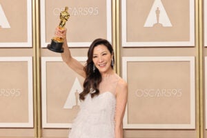 Michelle Yeoh holds an Oscar