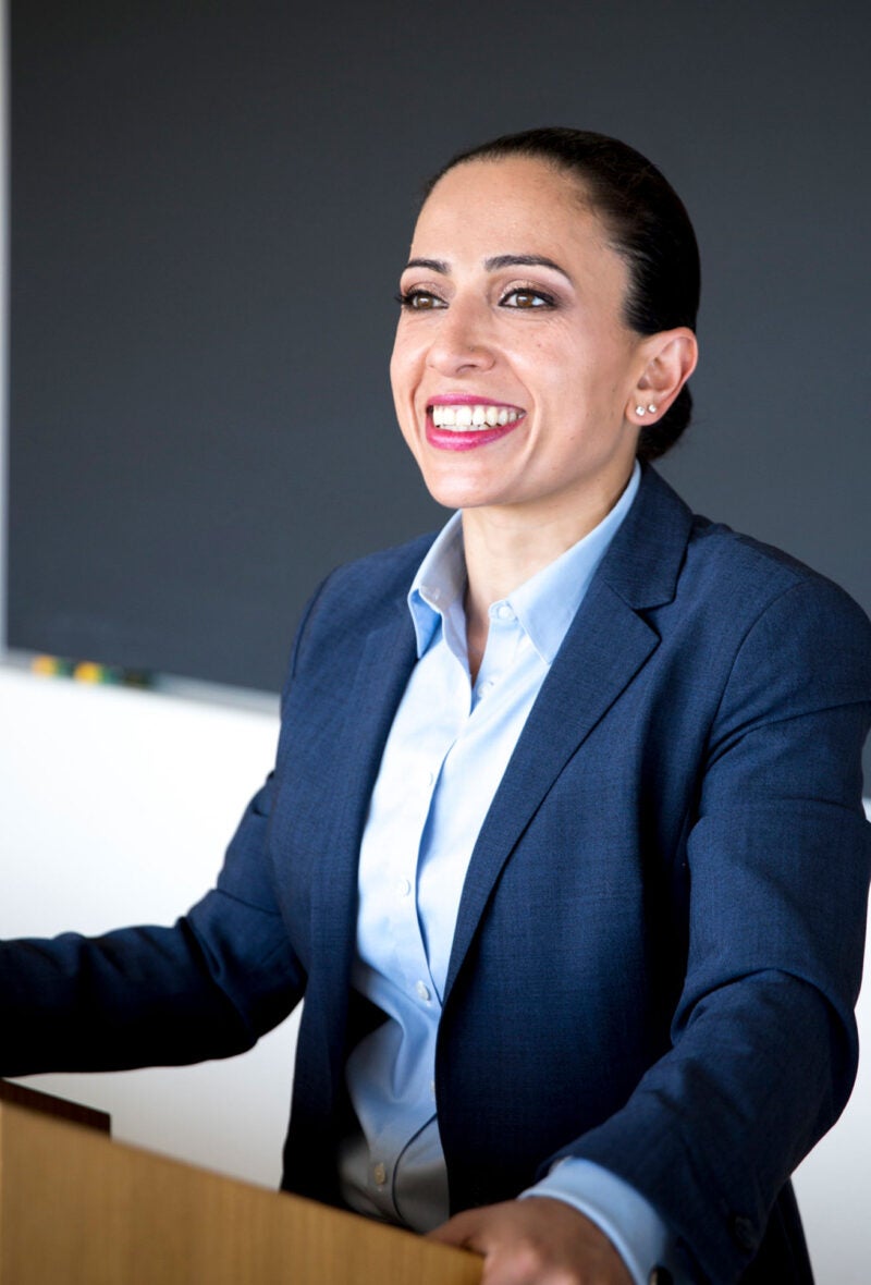 woman at a podium in front of a classroom