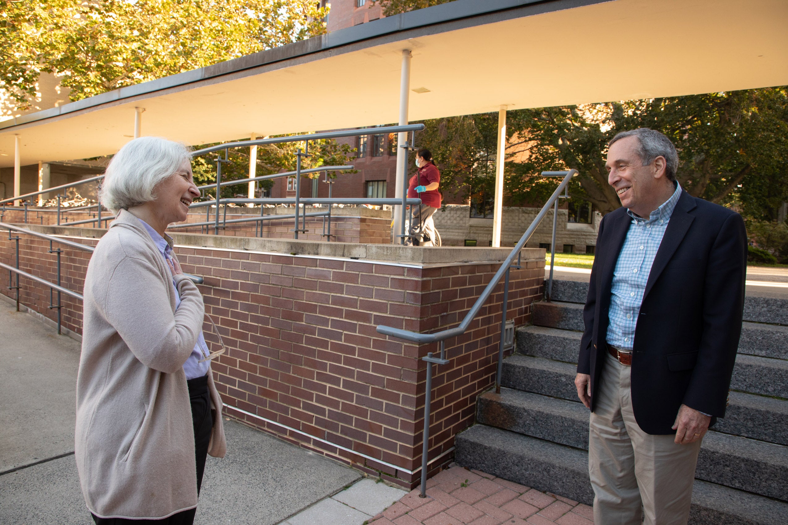 Martha Minow and Larry Bacow share a moment