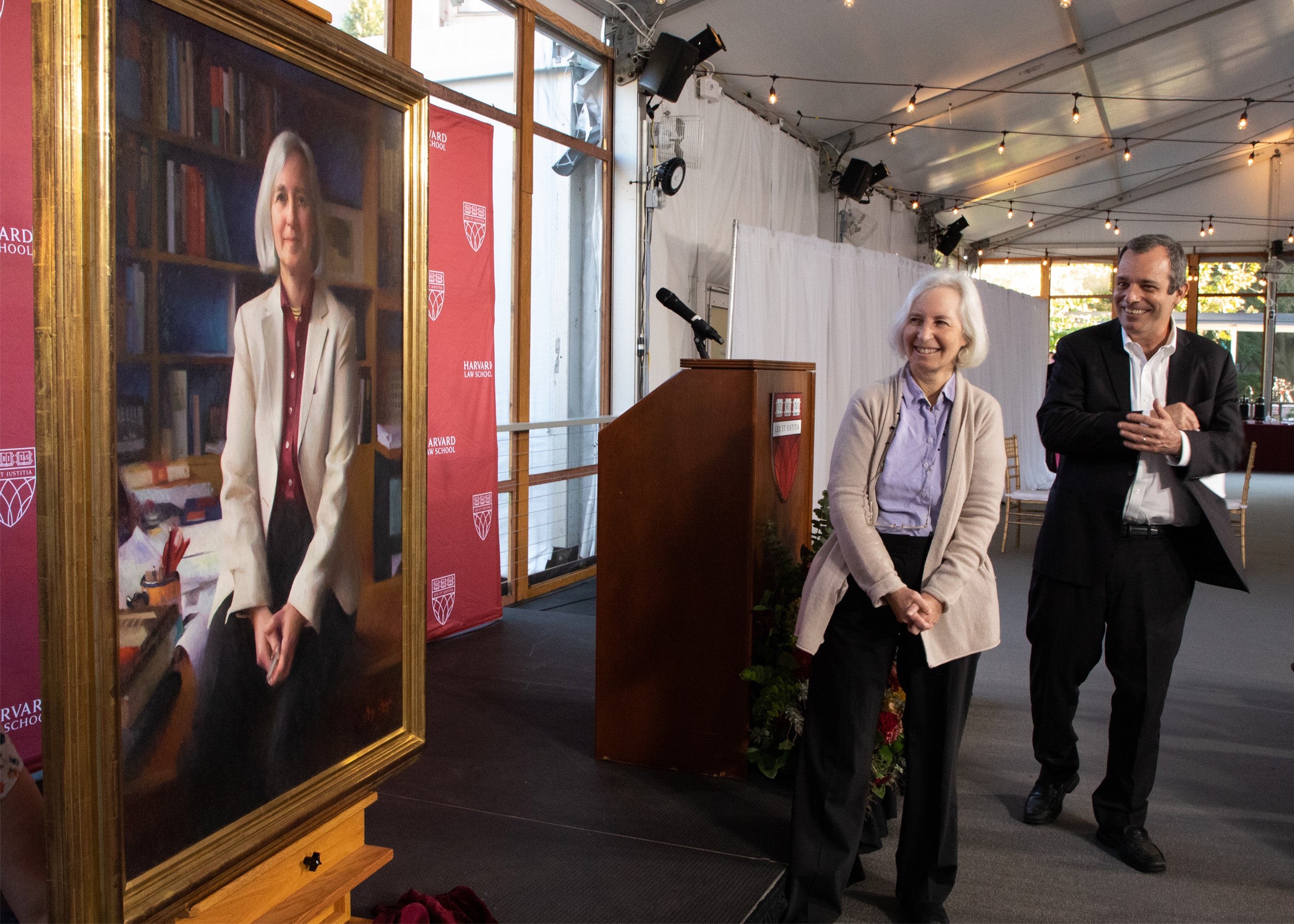 Martha Minow and John Manning admire recently unveiled portrait of Minow