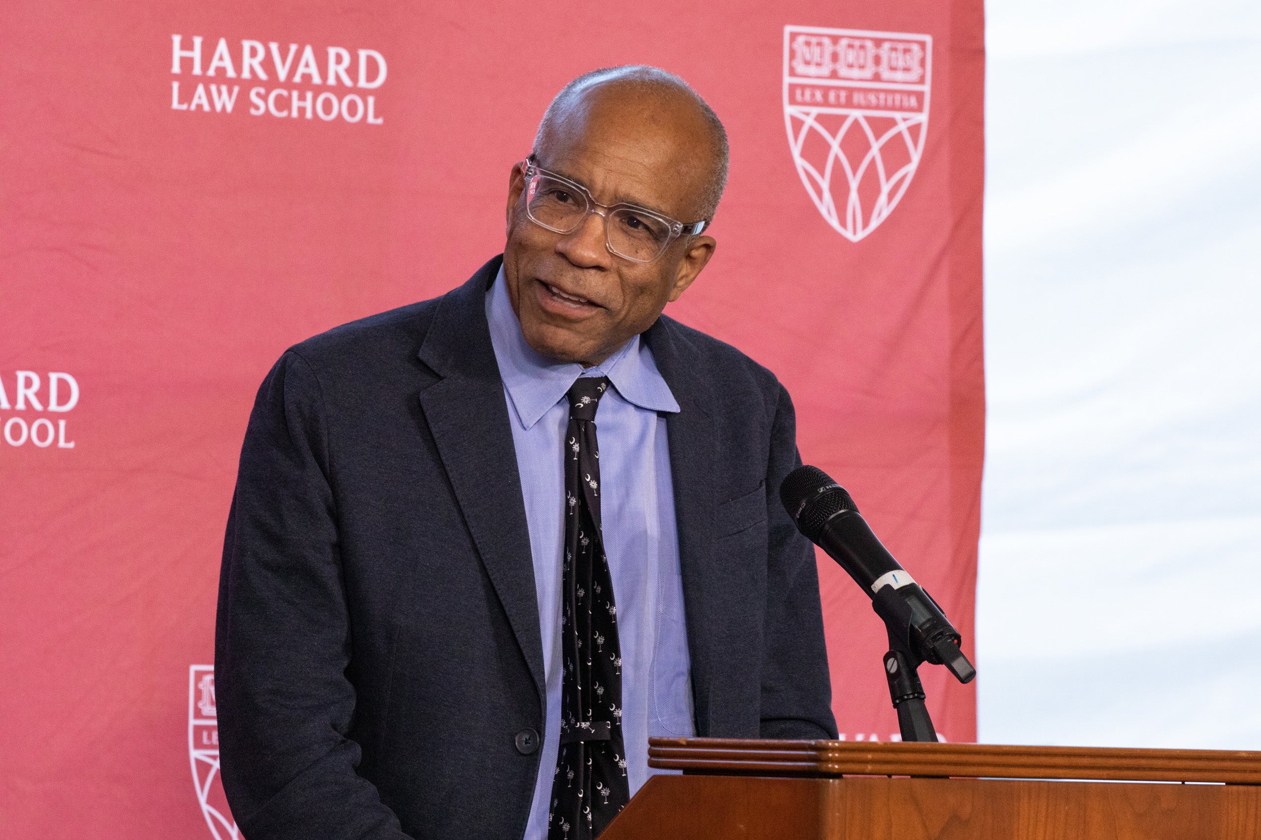 Man speaks at podium
