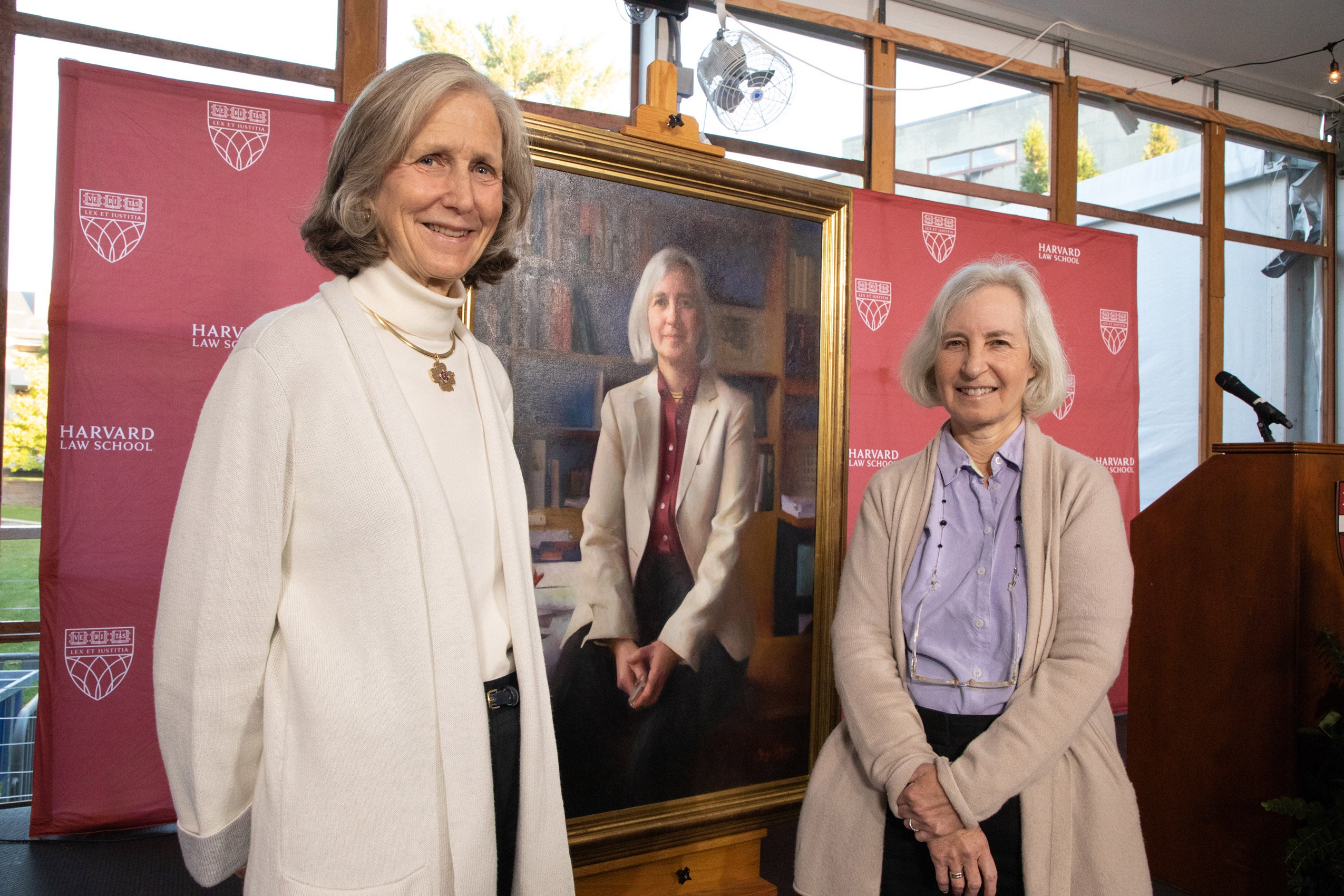 Mary Minifie and Martha Minow in front of portrait