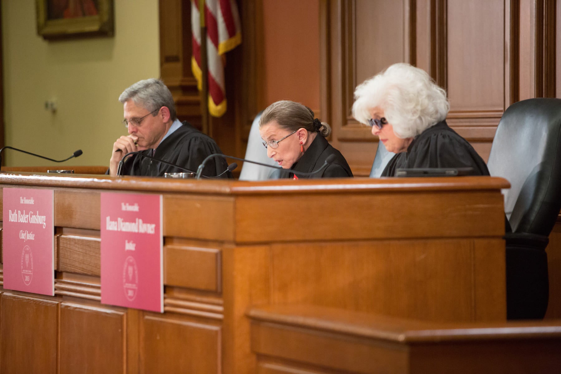Three judges in a courtroom