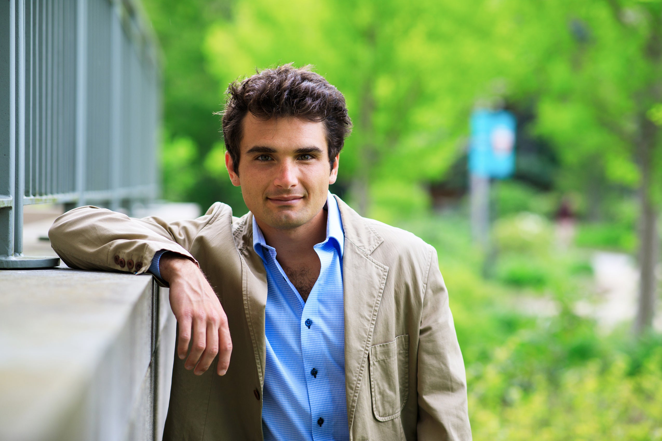Portrait of Robb Dehney ’23 in a tan blazer.