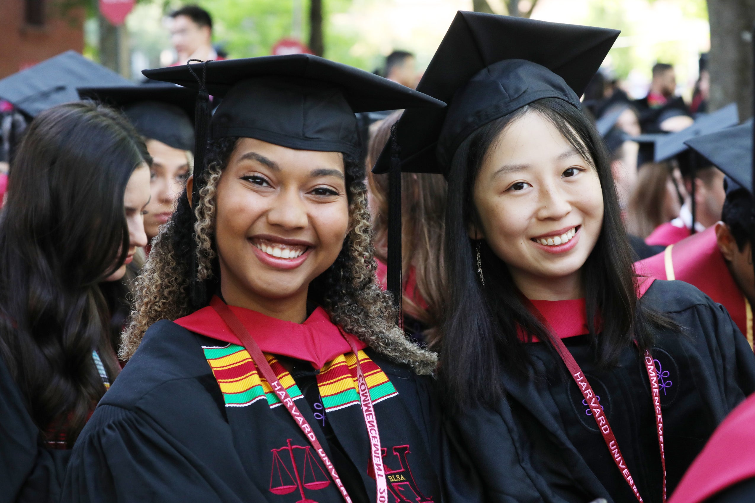 Two women smile on graduation day