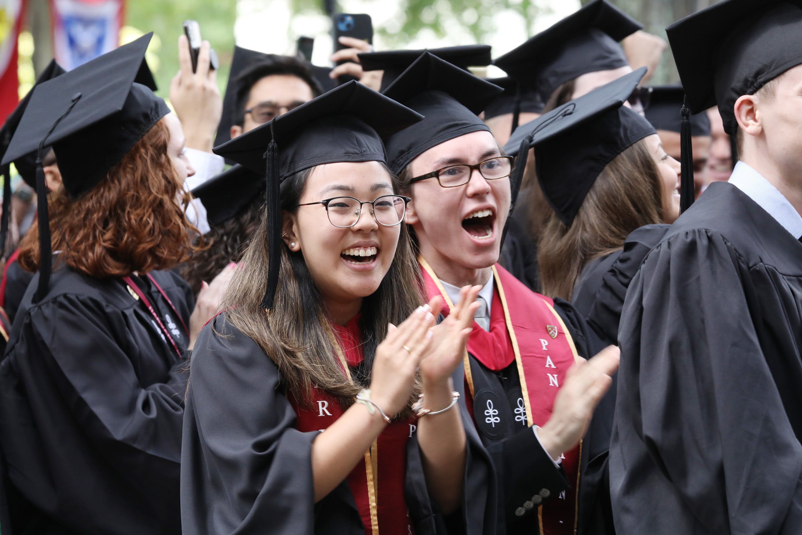 Graduates clap and cheer