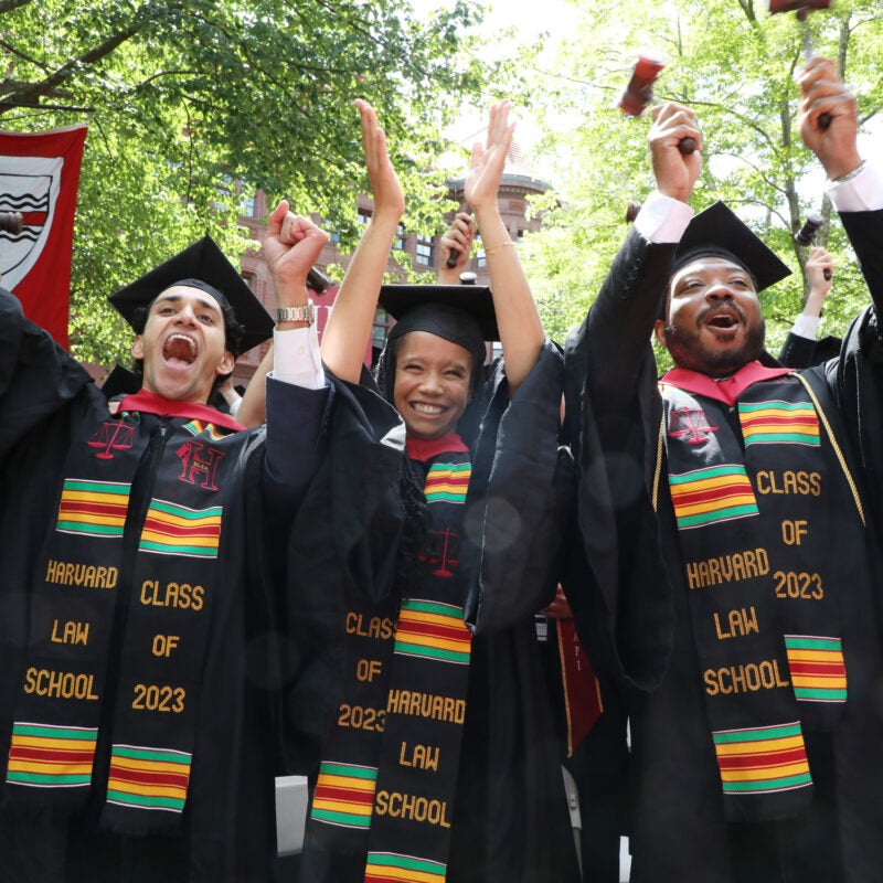 Grads with BLSA sashes cheer and hold up gavels