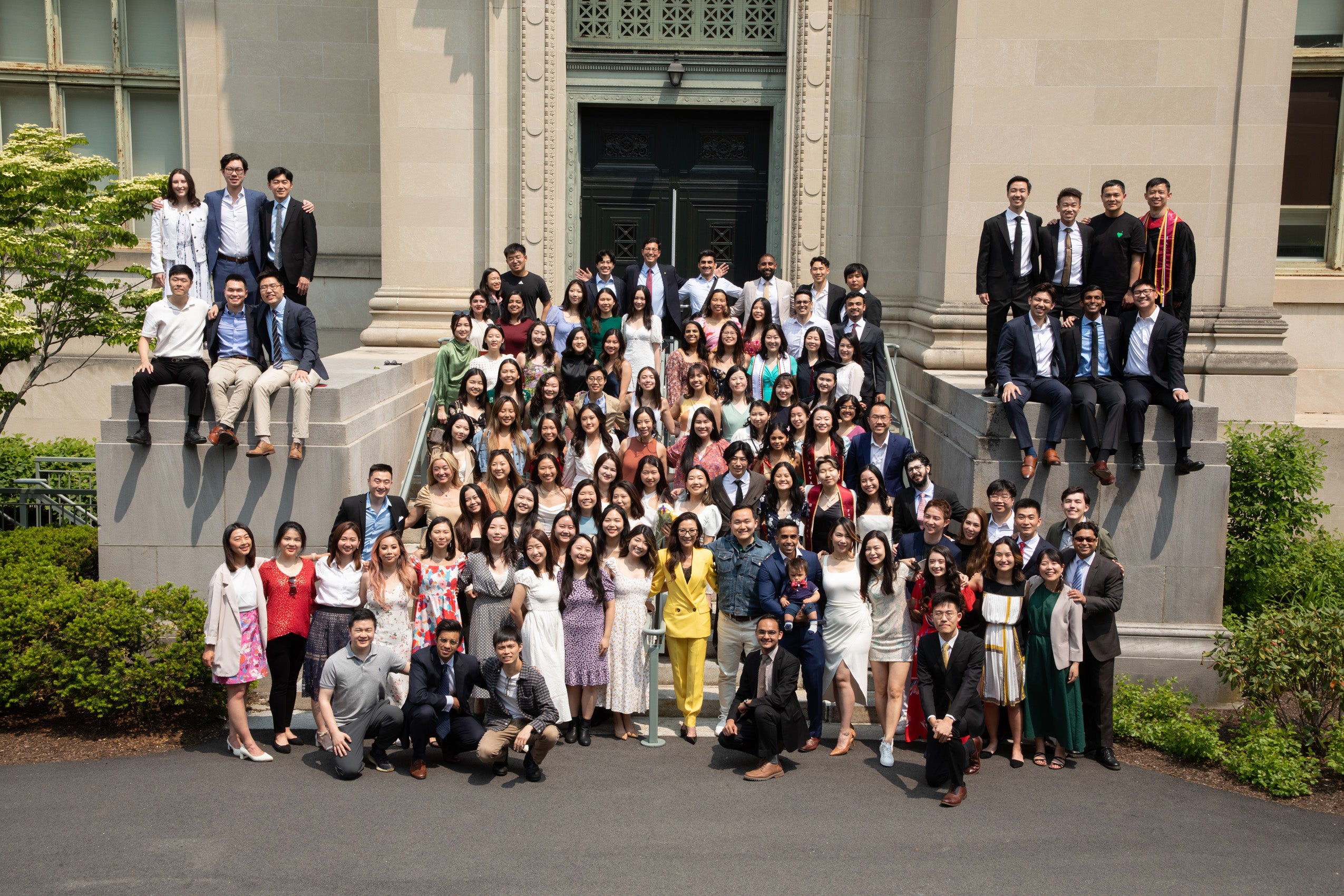 Michelle Yeoh and a large group of students standing on the steps of Langdell