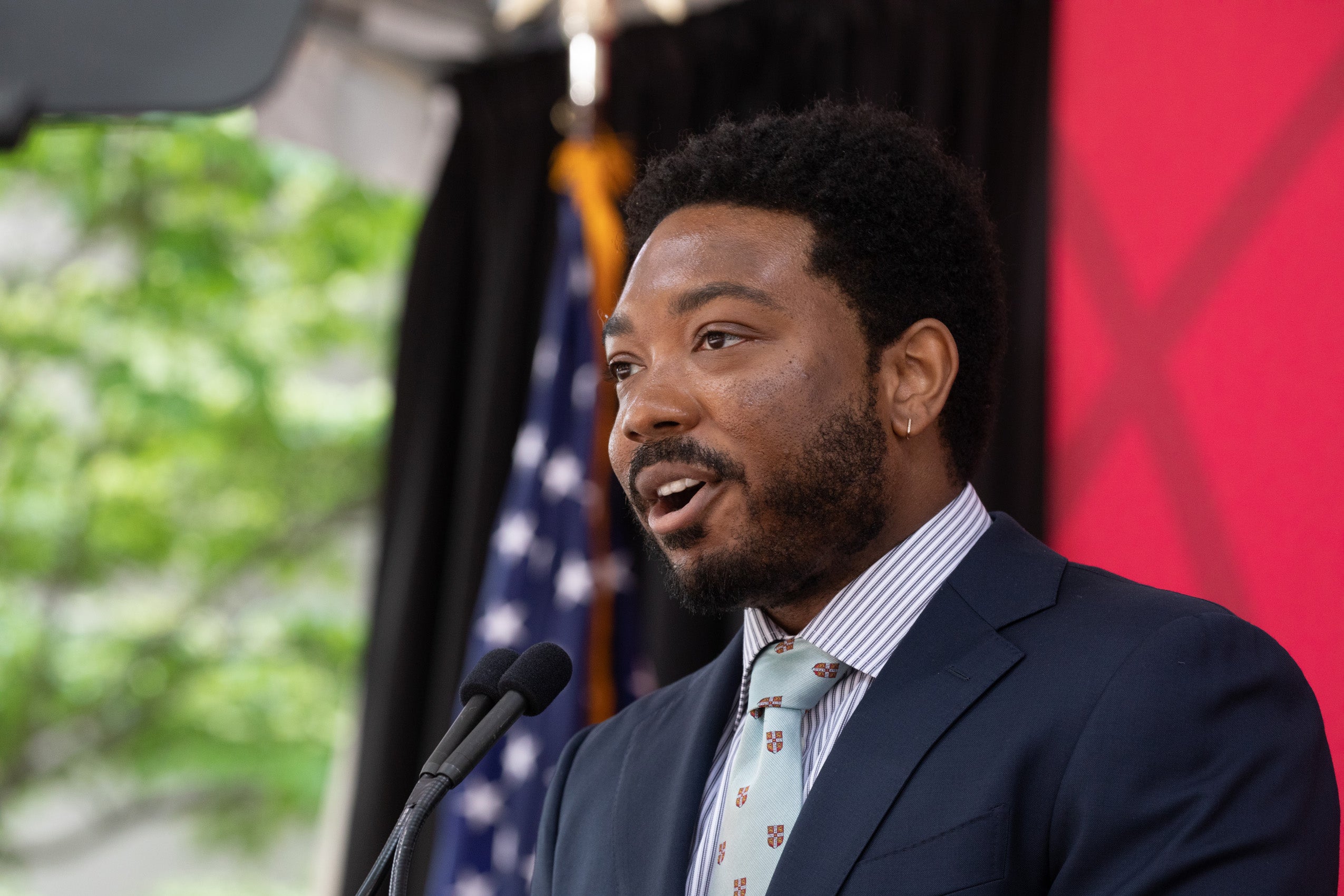 Jordan Rogers speaking on a stage