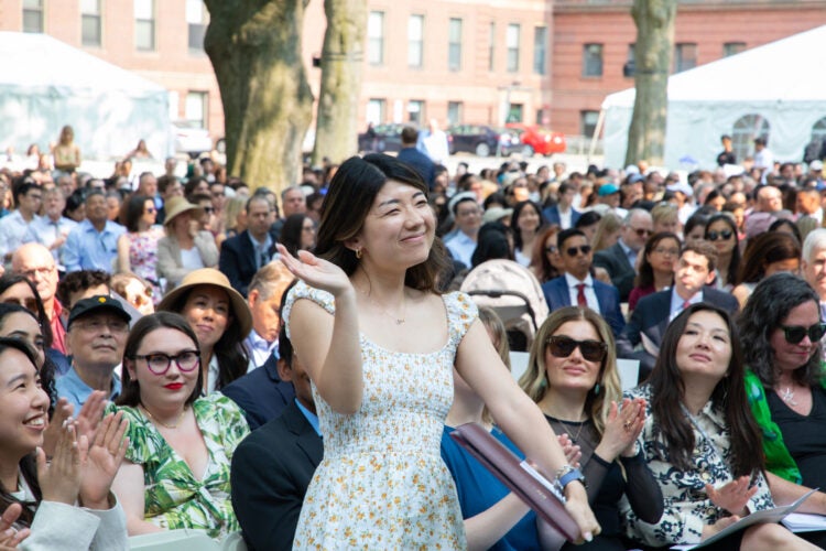 Barbara Tsao stands in crowd during Class Day ceremony