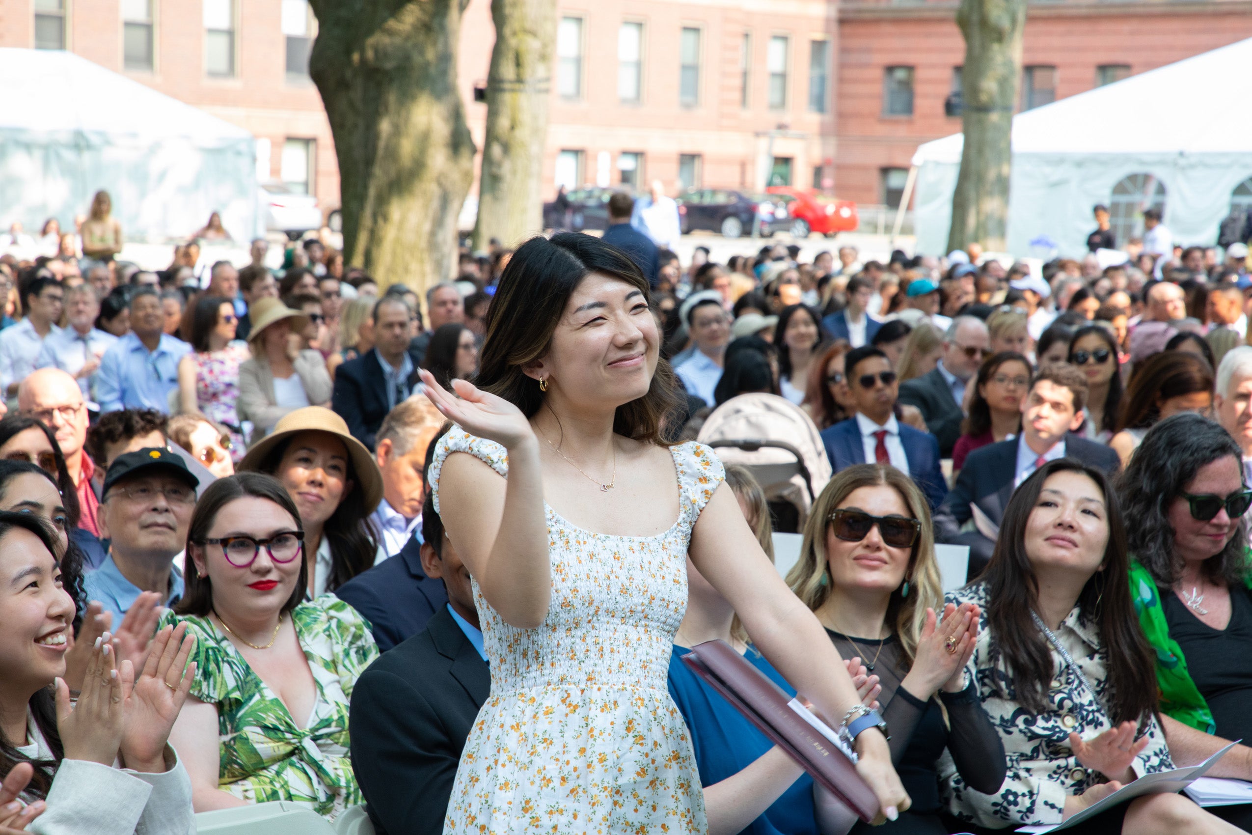 Barbara Tsao stands in crowd during Class Day ceremony