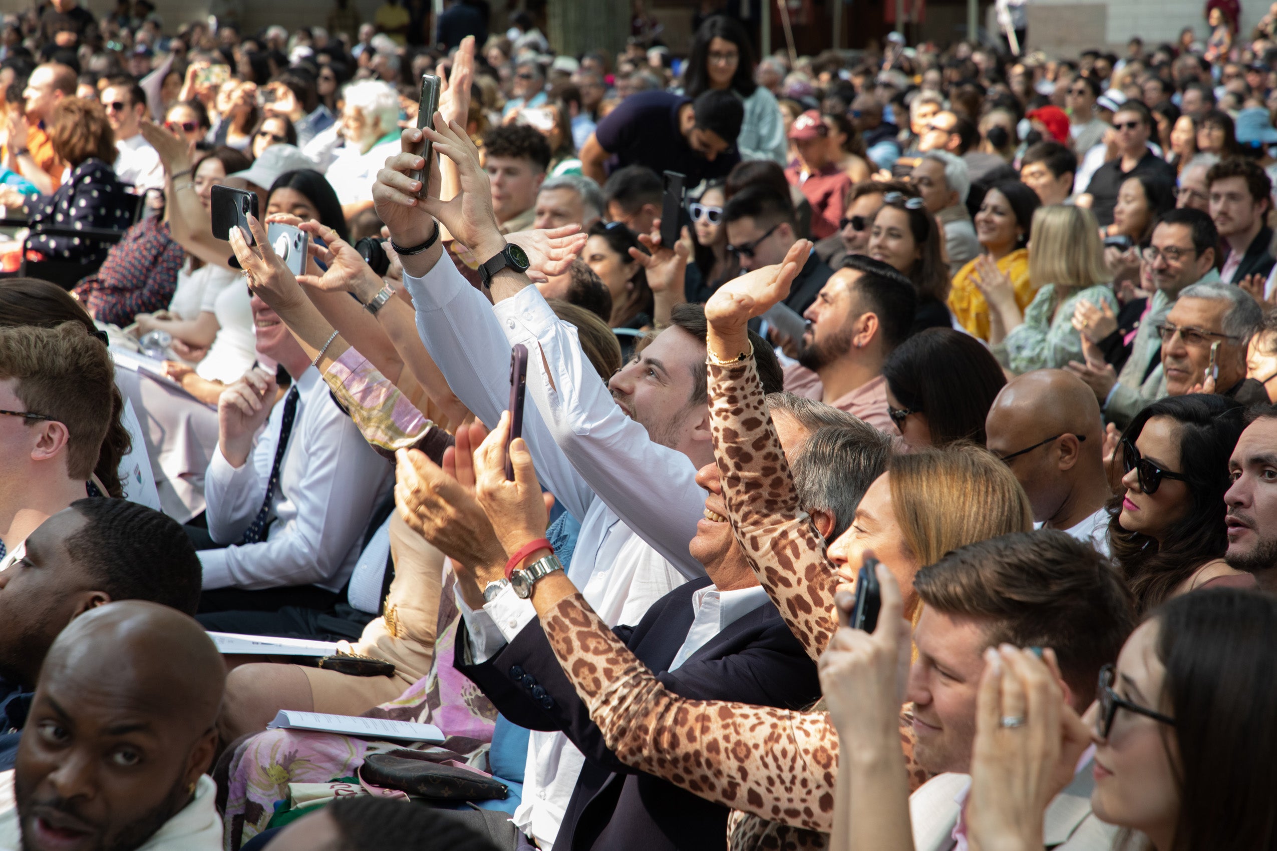 Crowd takes photos during Class Day speeches