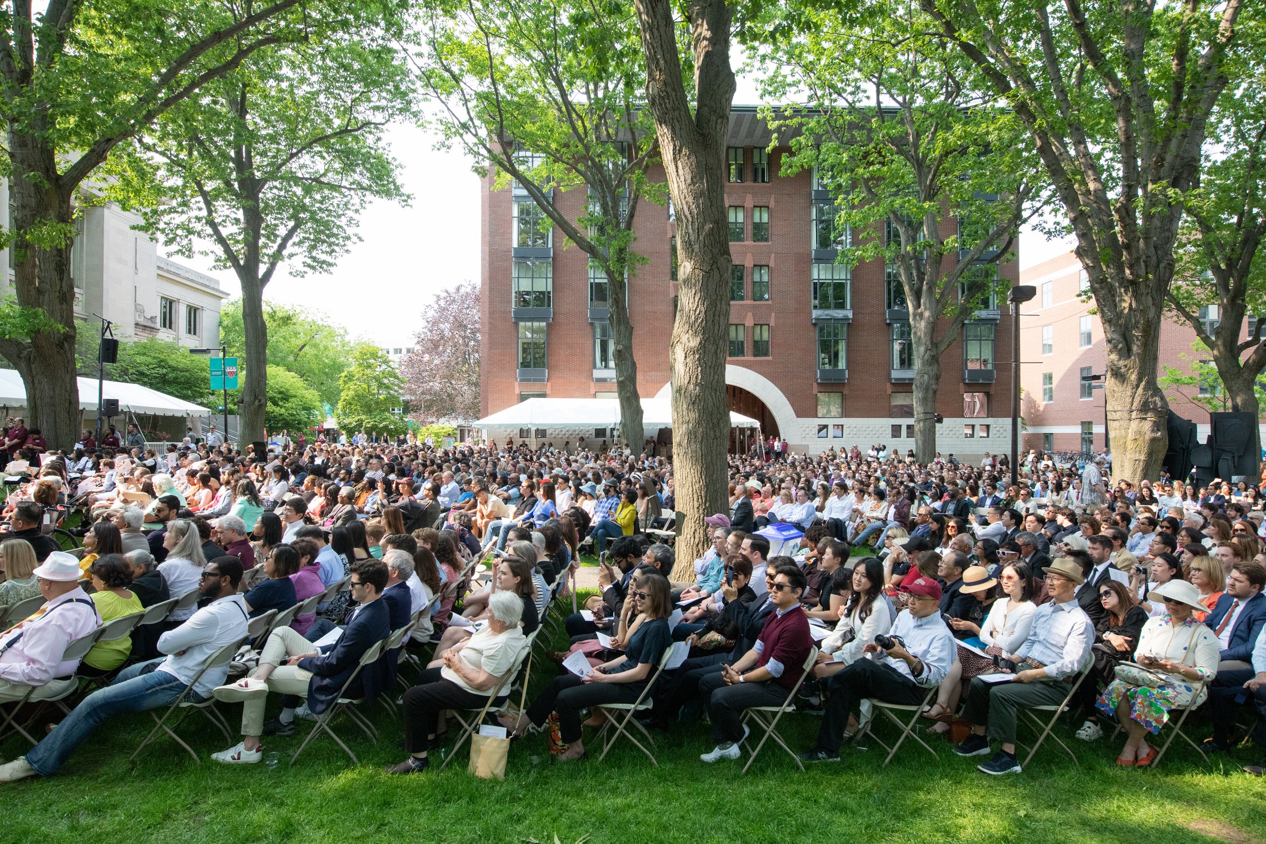 huge crowd of people sitting in chairs