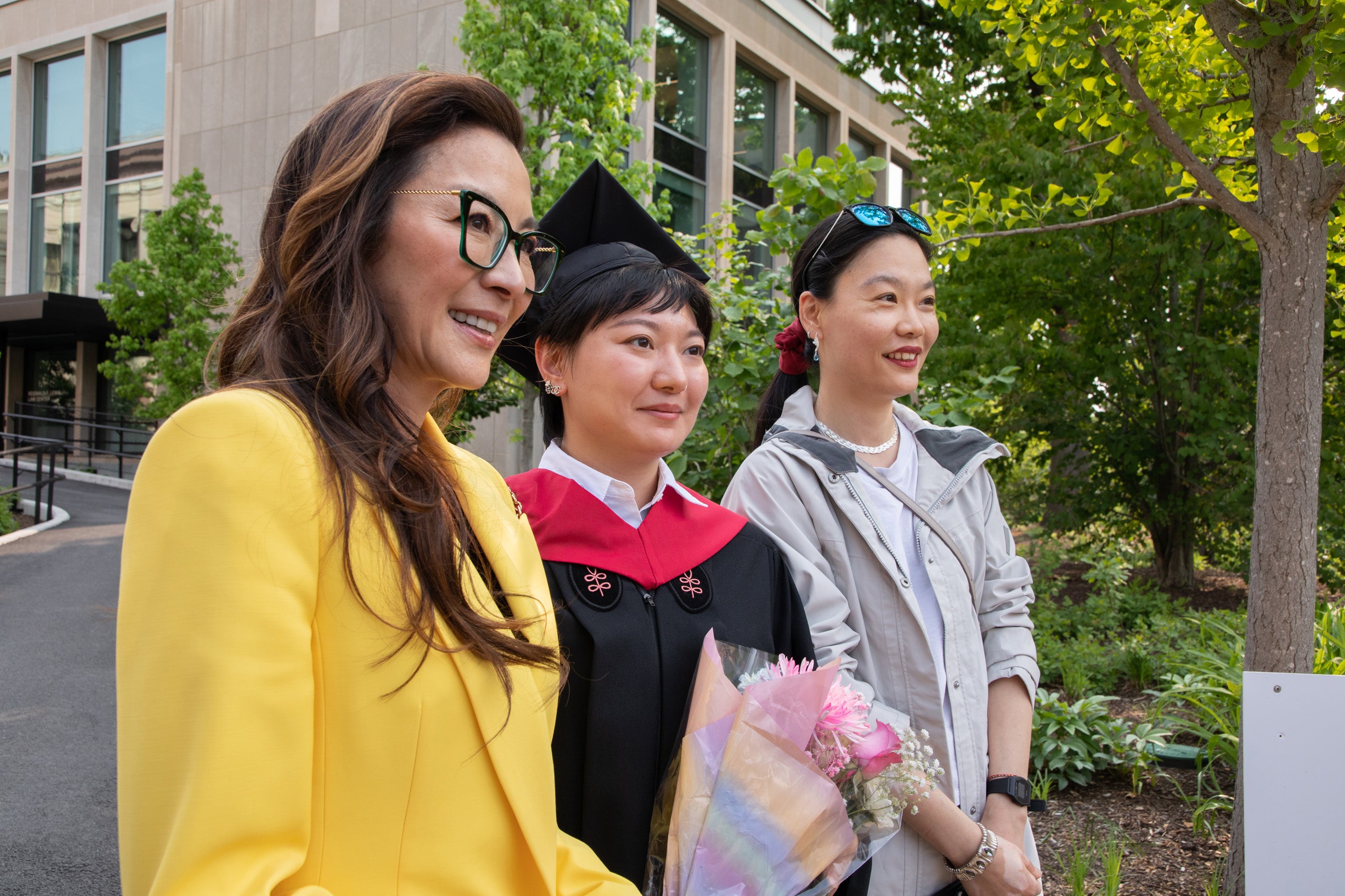 Michelle Yeoh poses with HLS graduate and guest