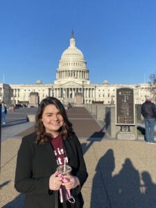 Ali Gentry stands in front of the Capitol