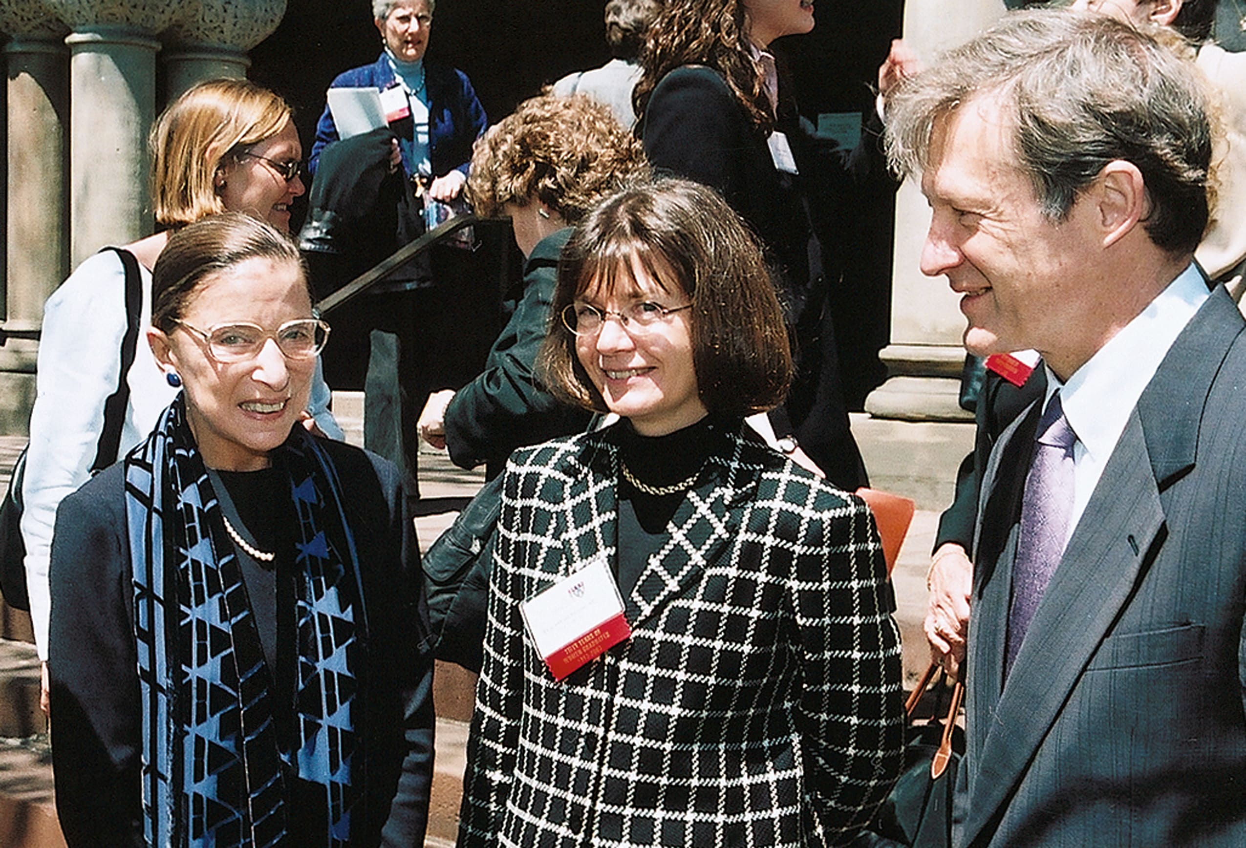 Two women and a man in front of Langdell