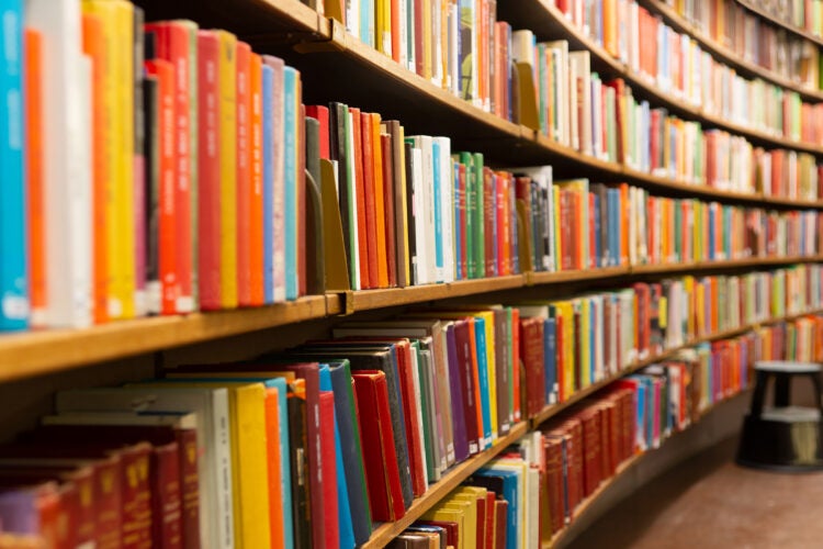 Colorful library books on shelves.