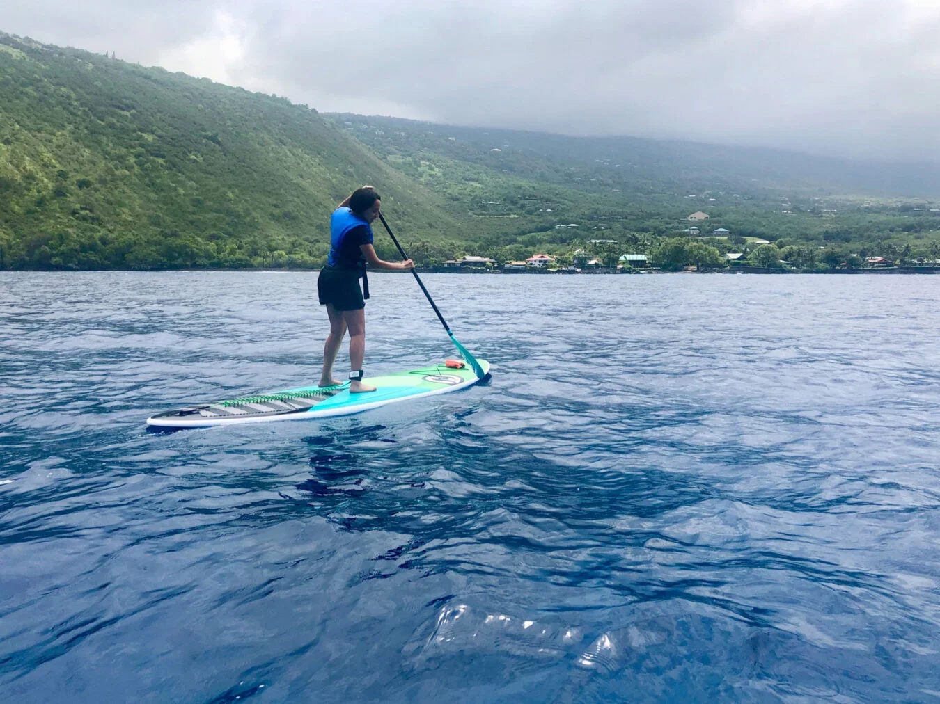 Girma enjoys stand up paddling in warm water.