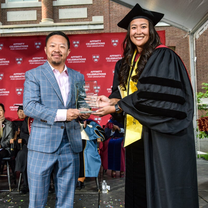 Alexander Chen receiving an award.