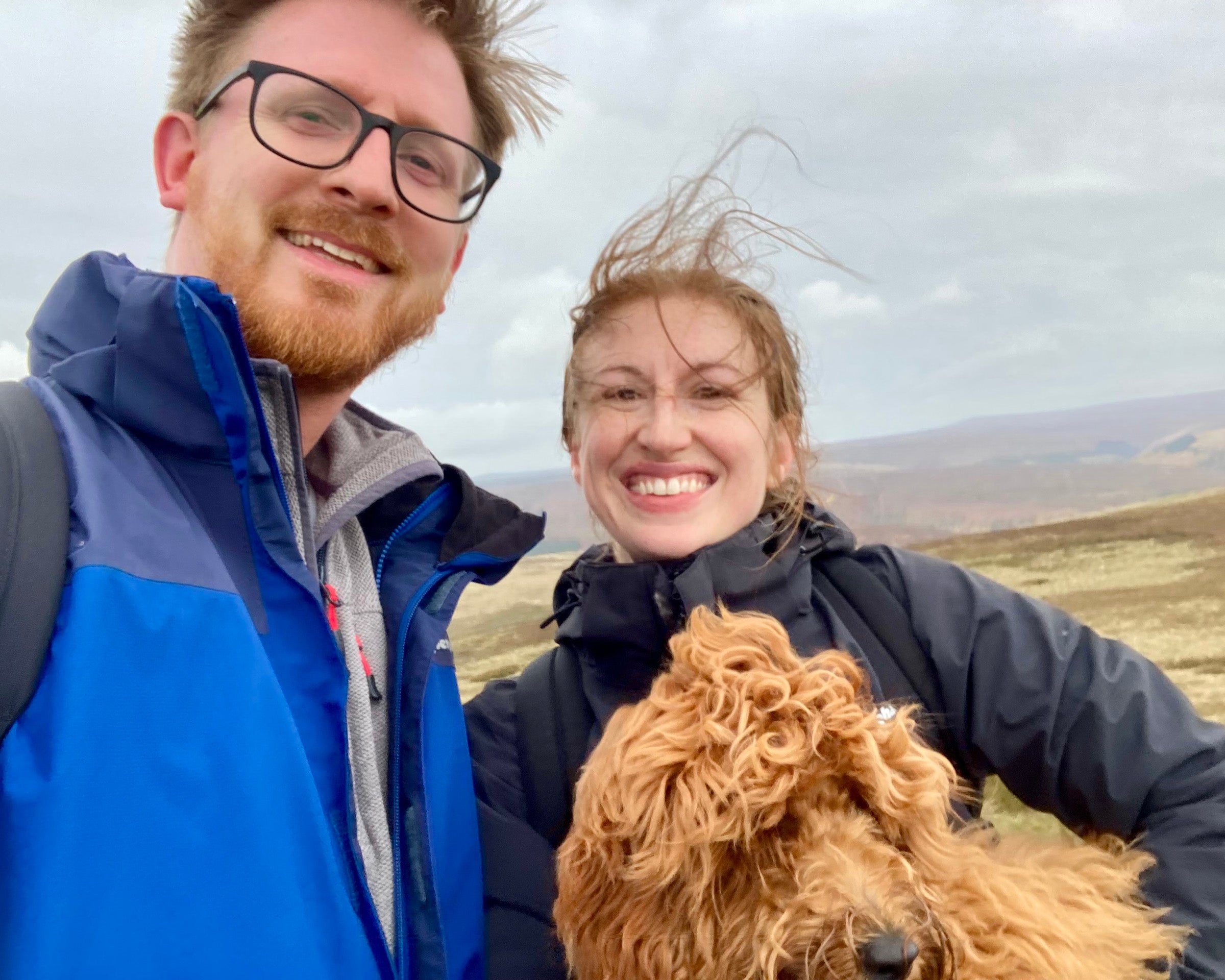 Caitlin Carey with her husband and their dog.