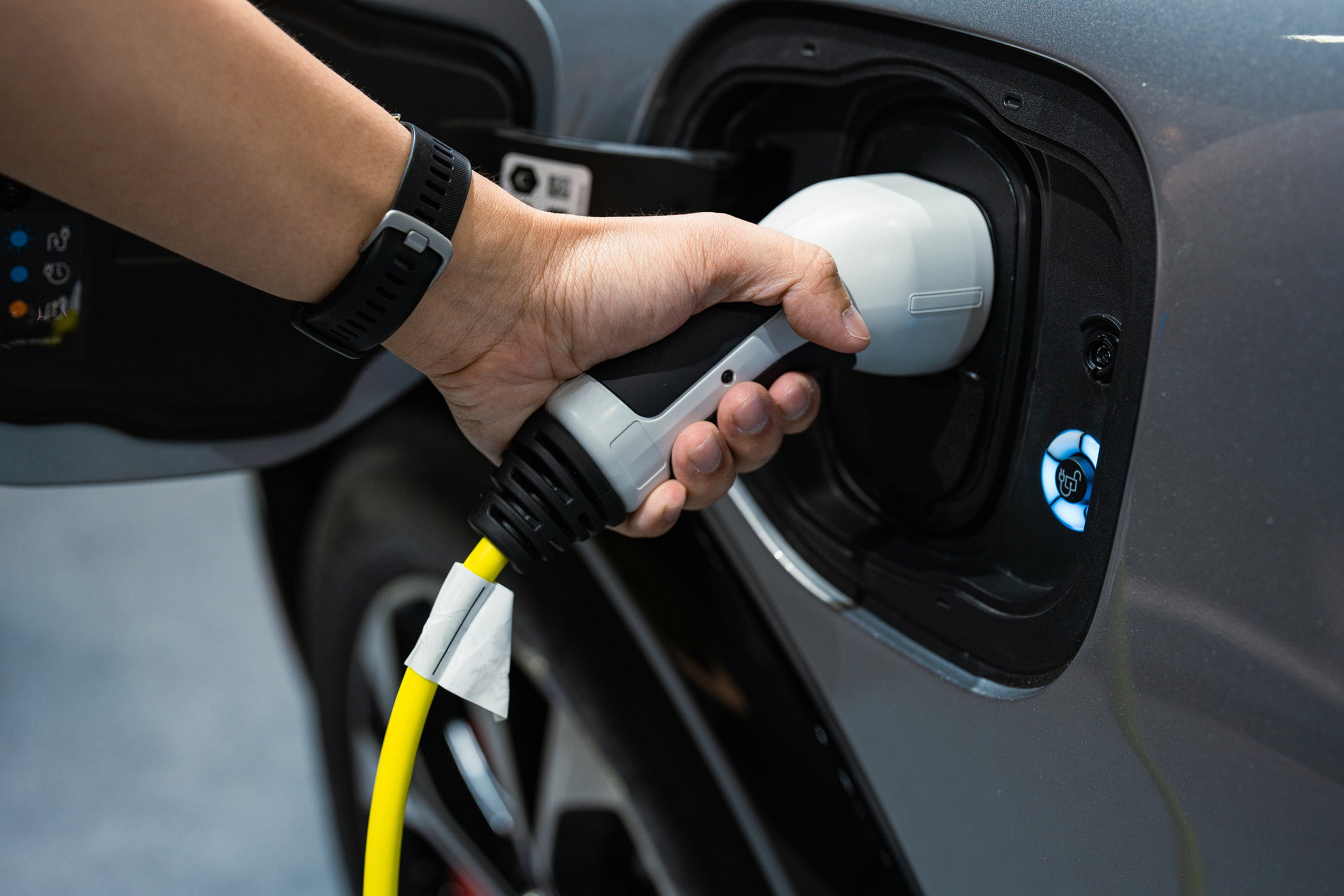 https://hls.harvard.edu/wp-content/uploads/2023/06/hand-charging-electric-vehicle-GettyImages-1388599279-2400.jpg