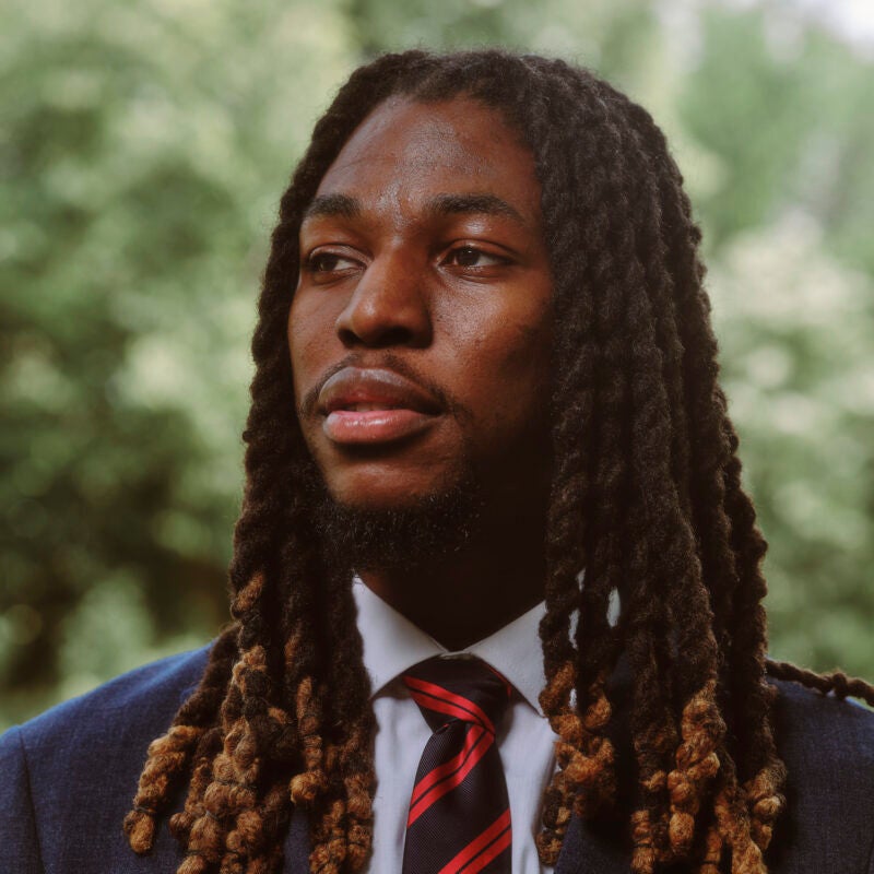 A close up of a man standing outside