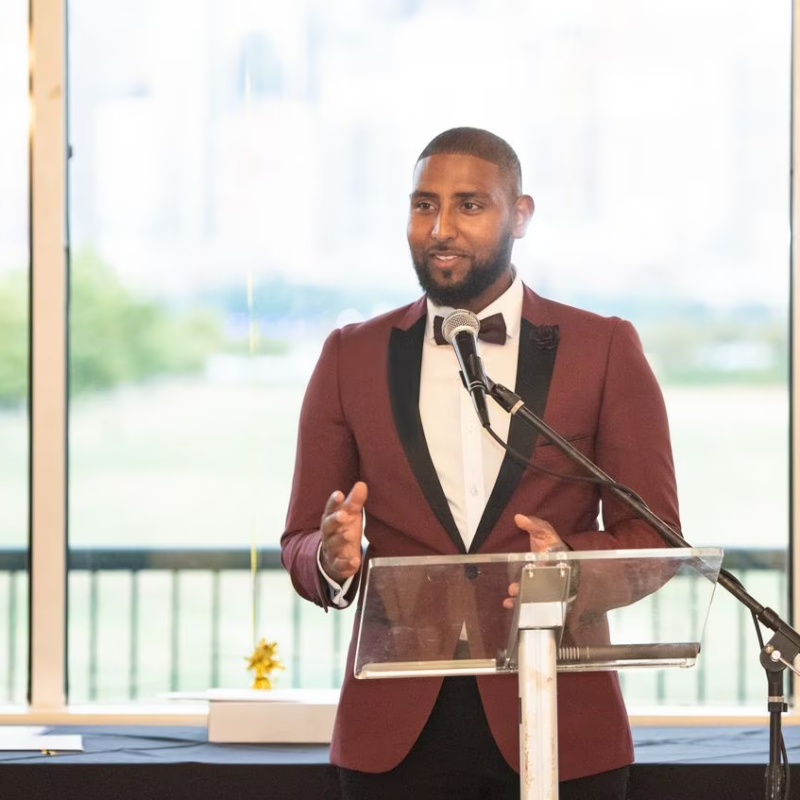 a man speaks at a podium