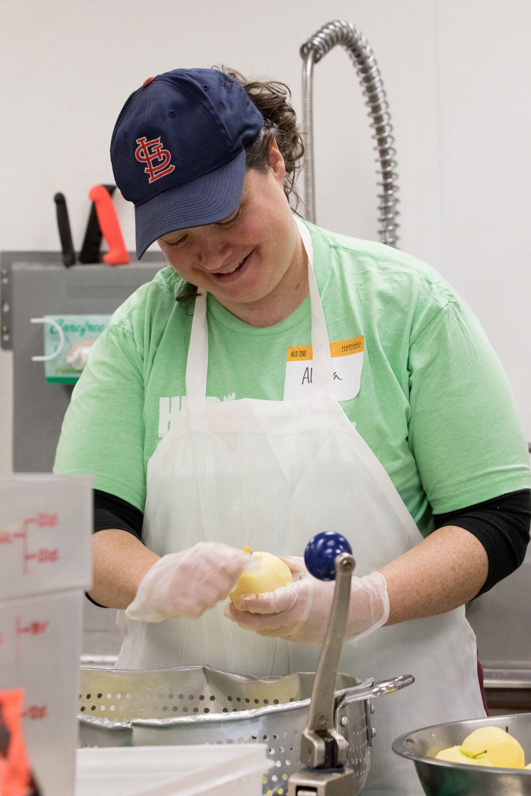 person peeling apples in a kitchen