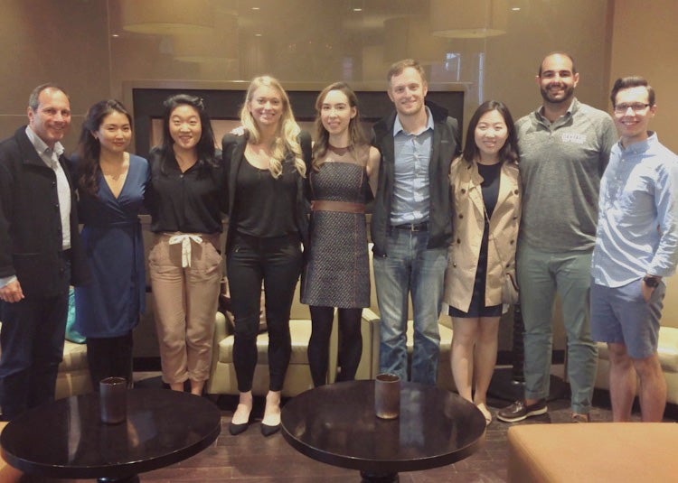 Group of people standing together with Amanda Brandford