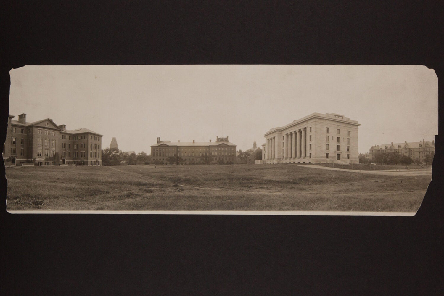 Three buildings around a field
