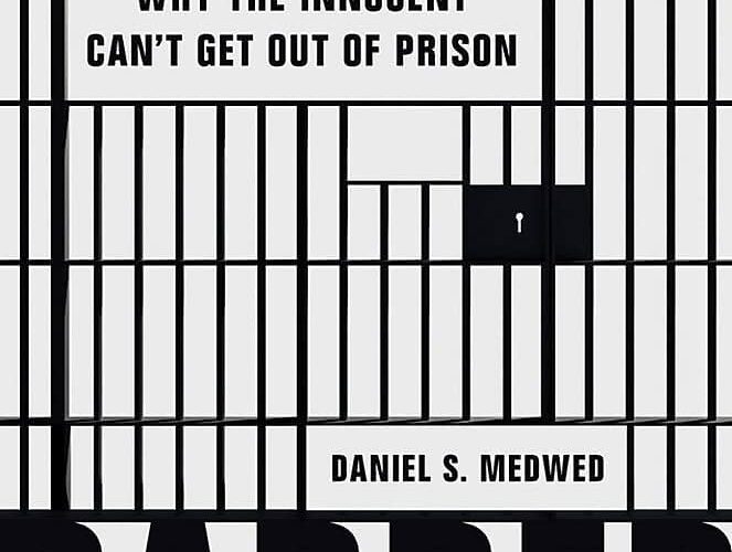 Book cover, black and white photograph of prison bars.