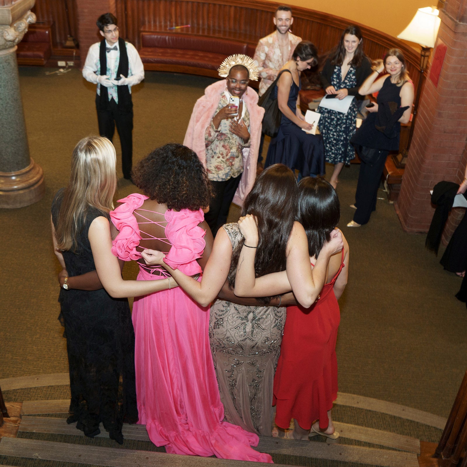 Student photographing a group.