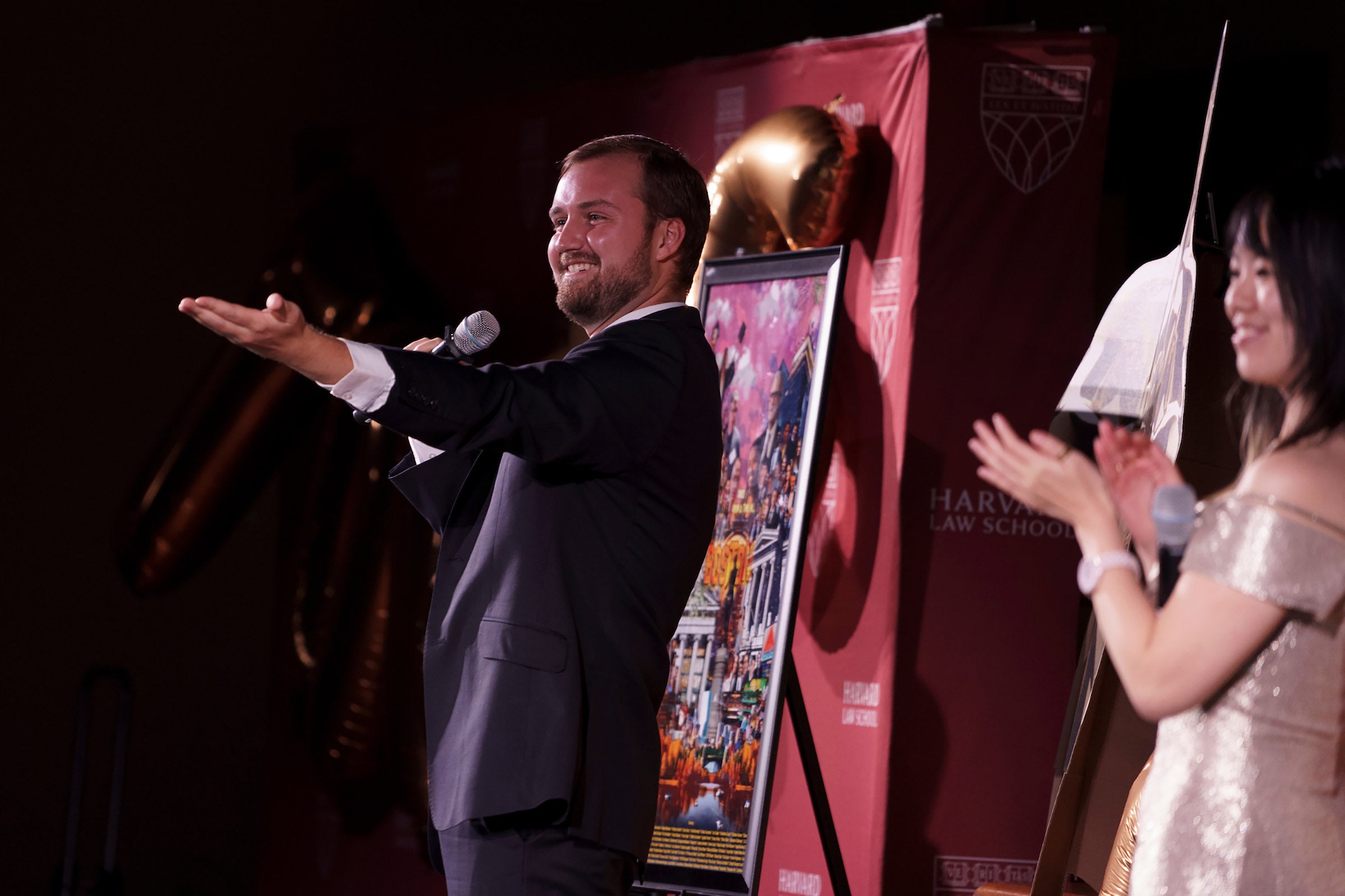 Student gesturing to the Tortys audience.