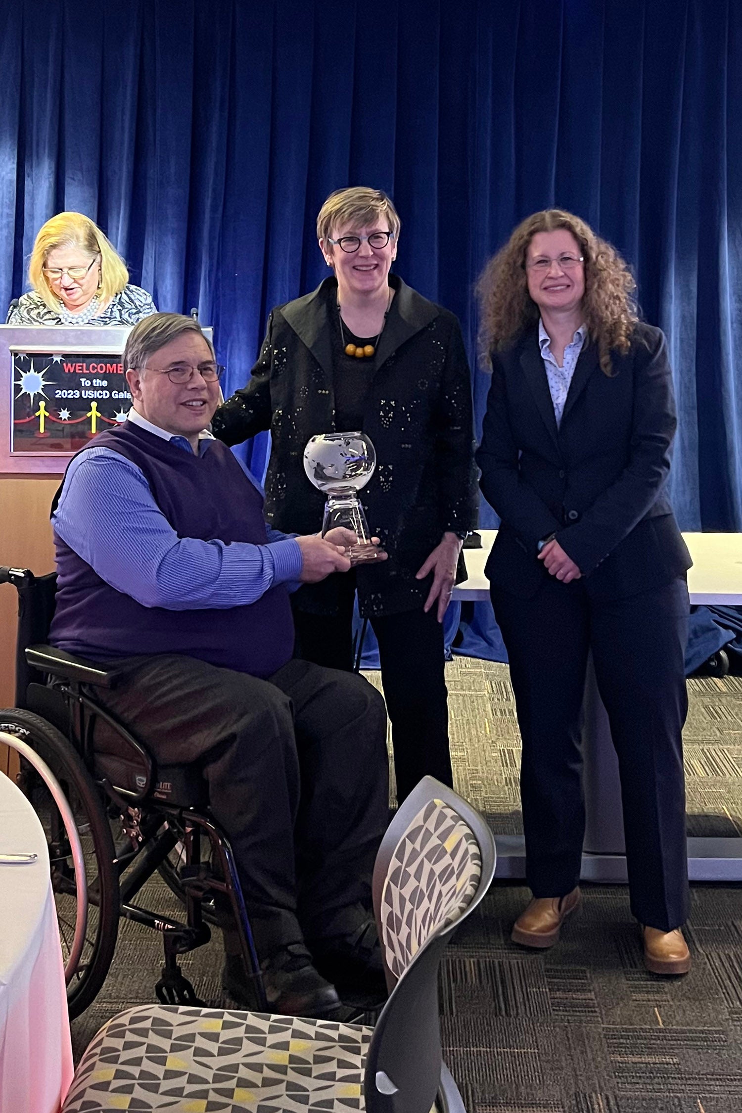 Michael Ashley Stein displays award alongside members of the International Council on Disabilities.