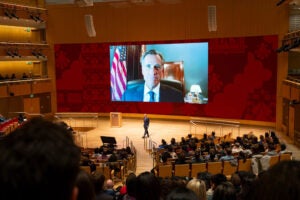 Mitt Romney on a video screen.