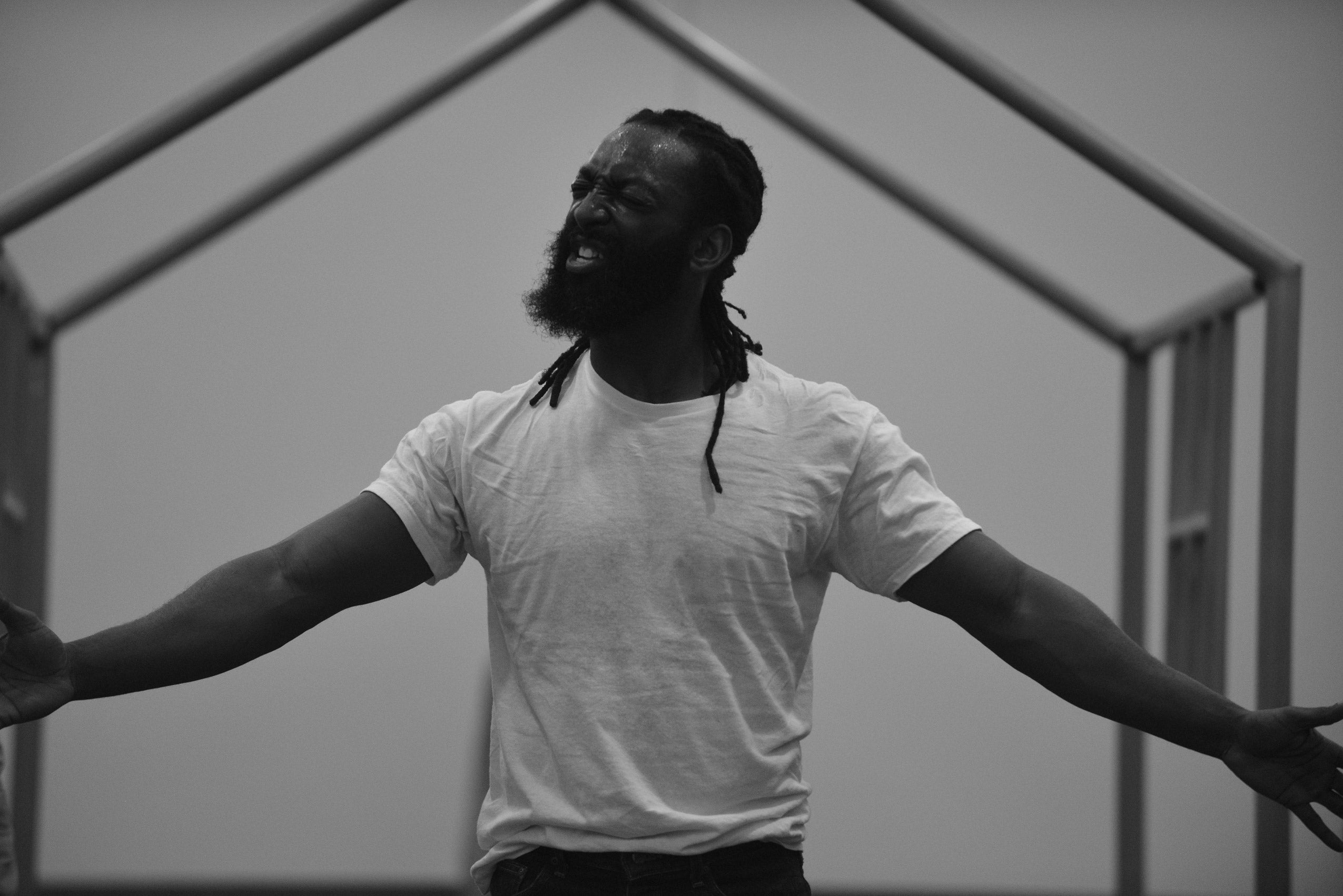 A man with his arms outstretched at his sides