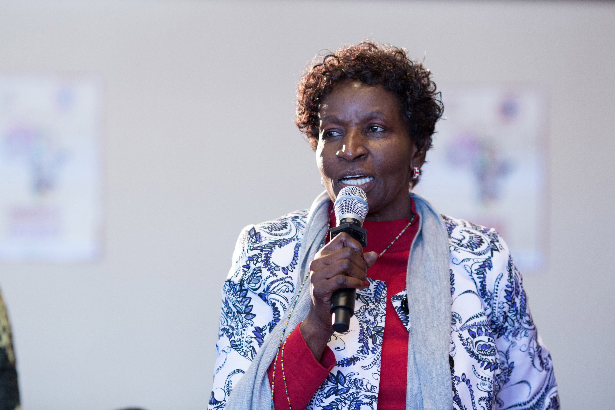 A woman speaking into a microphone