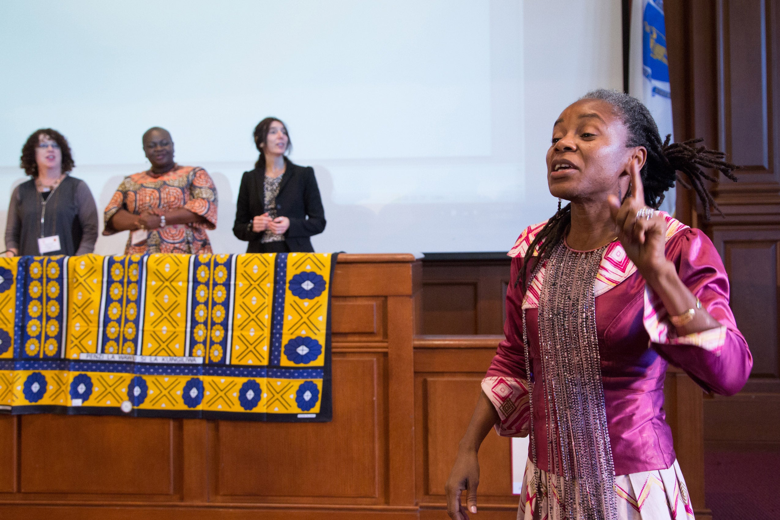 A woman standing and speaking