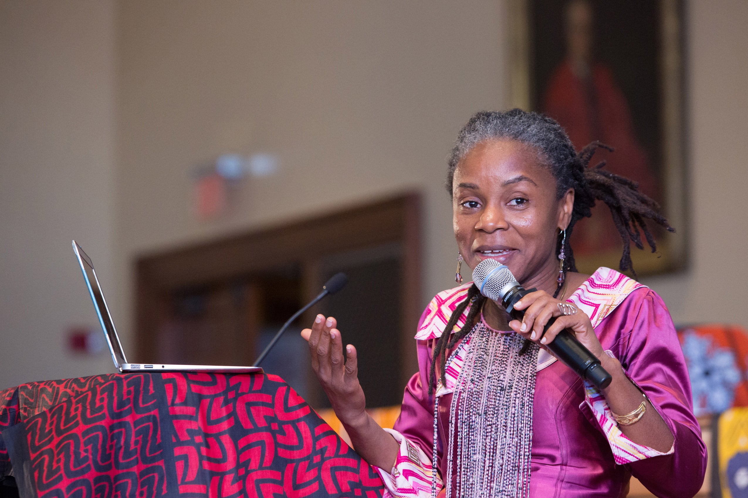 A woman speaking into a microphone