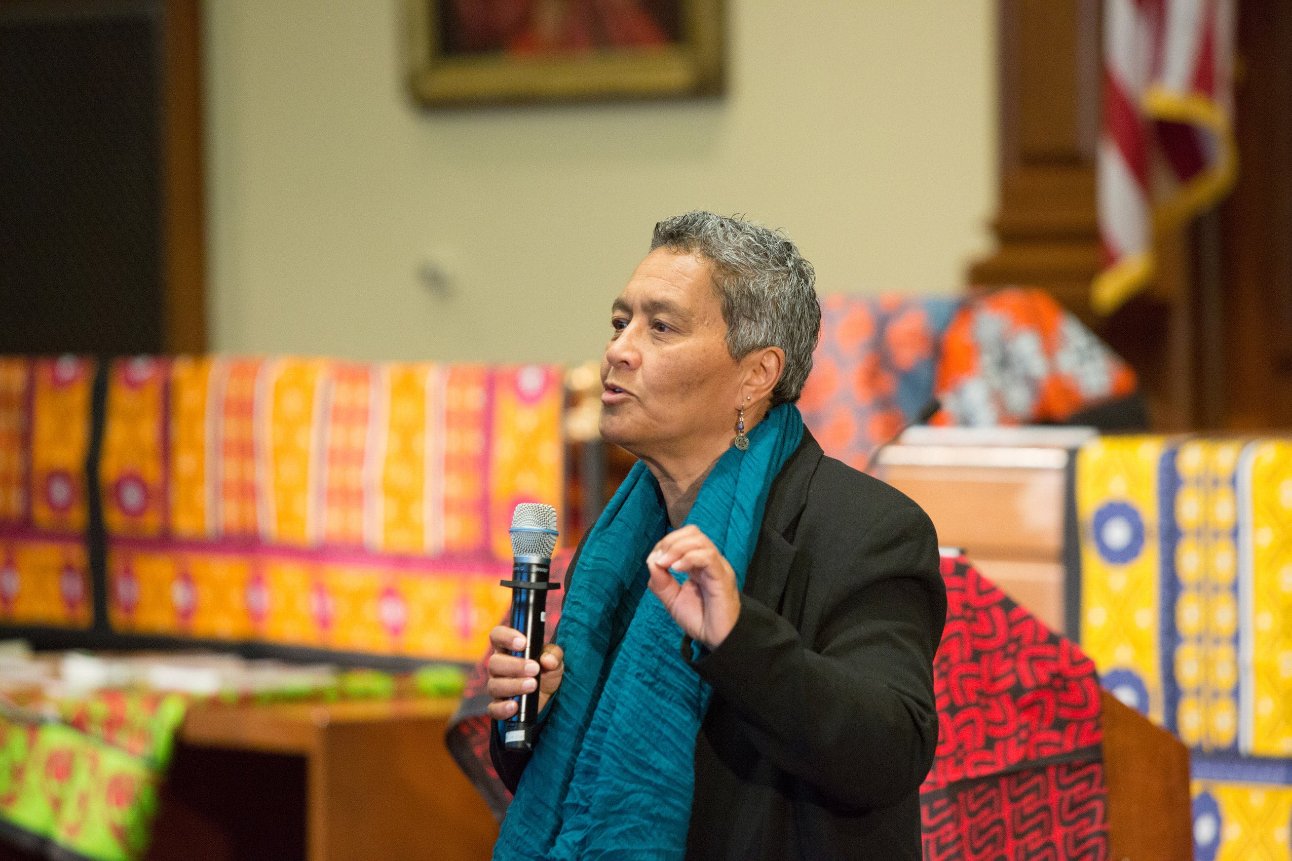 A woman speaking into a microphone