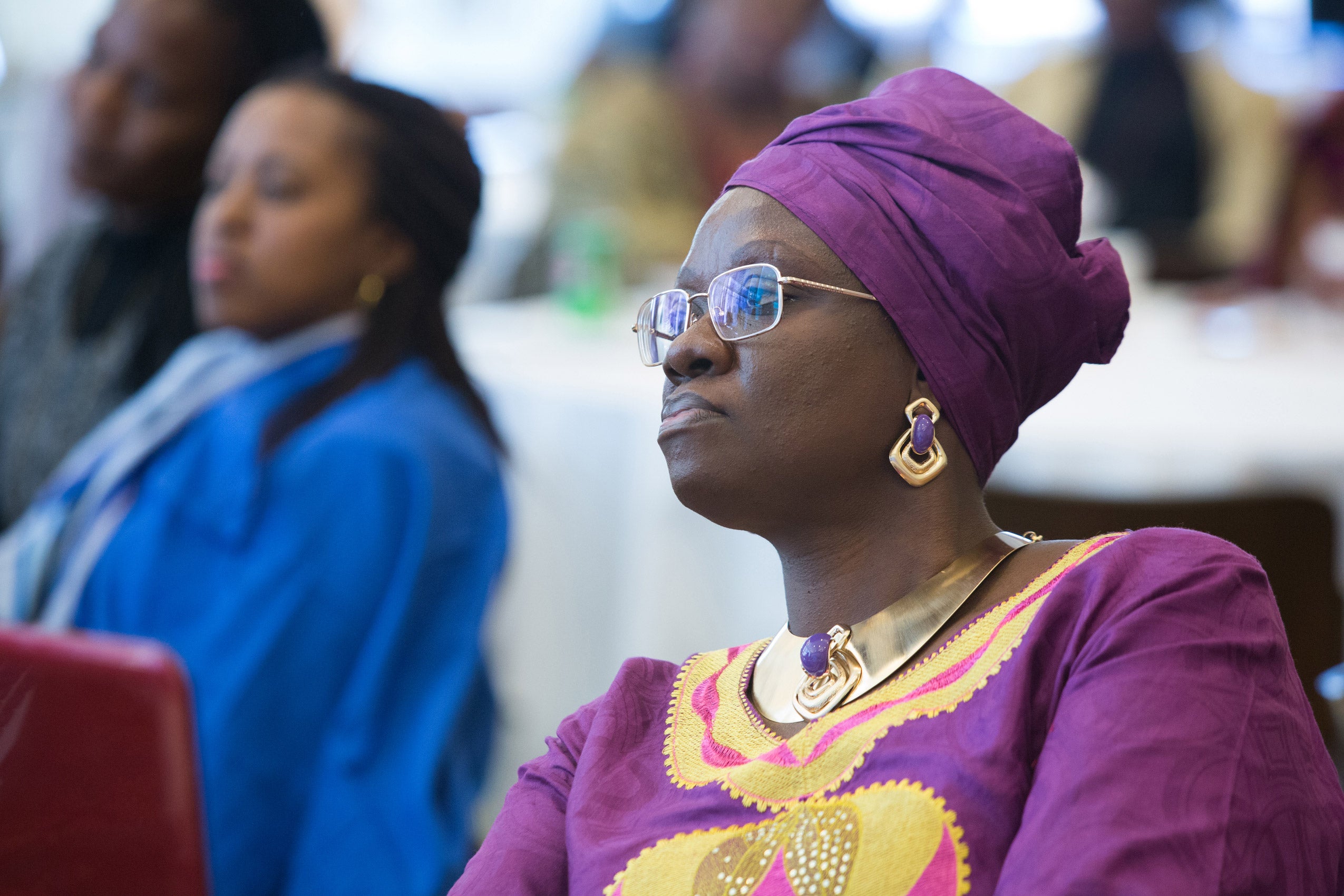 A woman sitting and listening