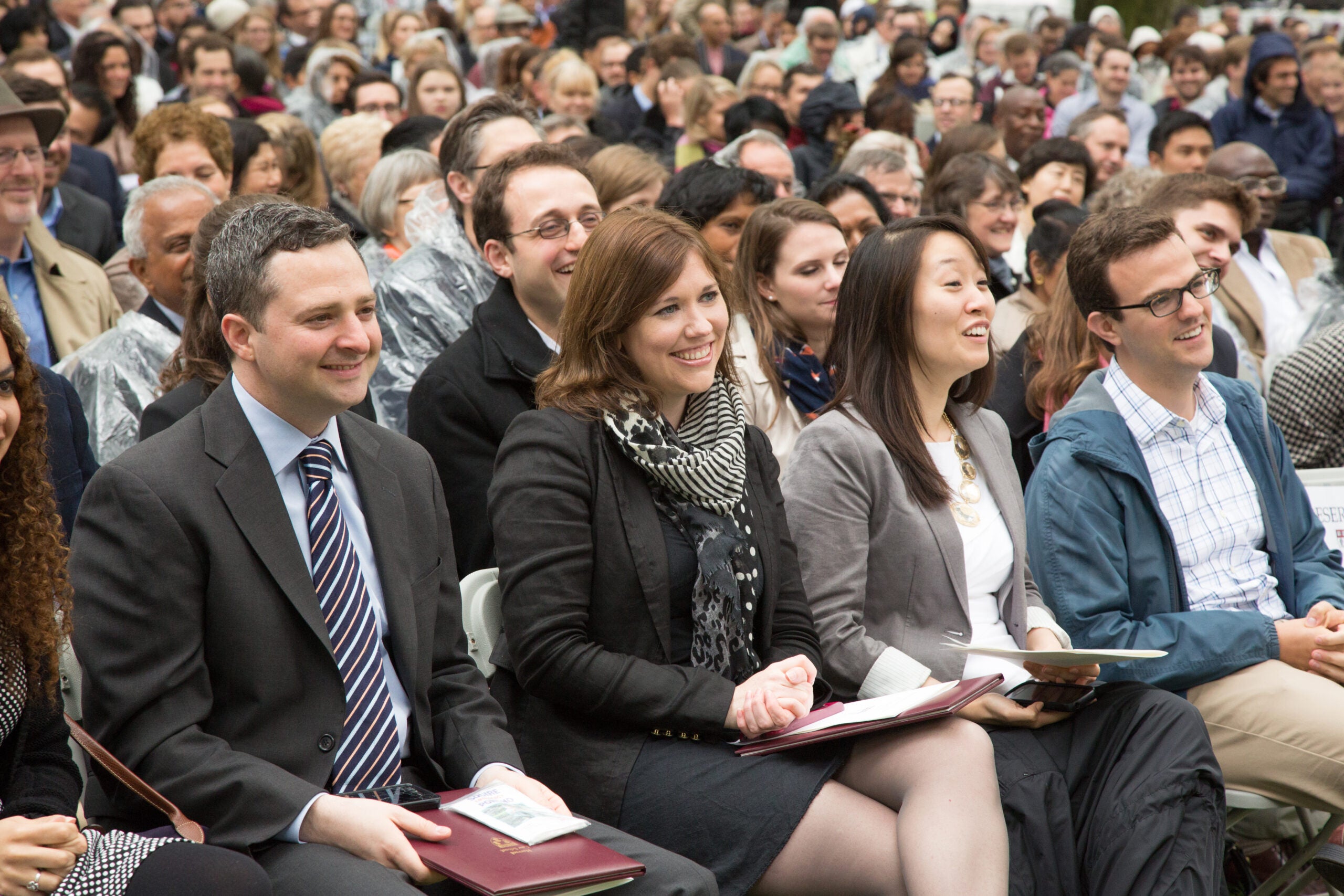 A crowd of people seated and smiling