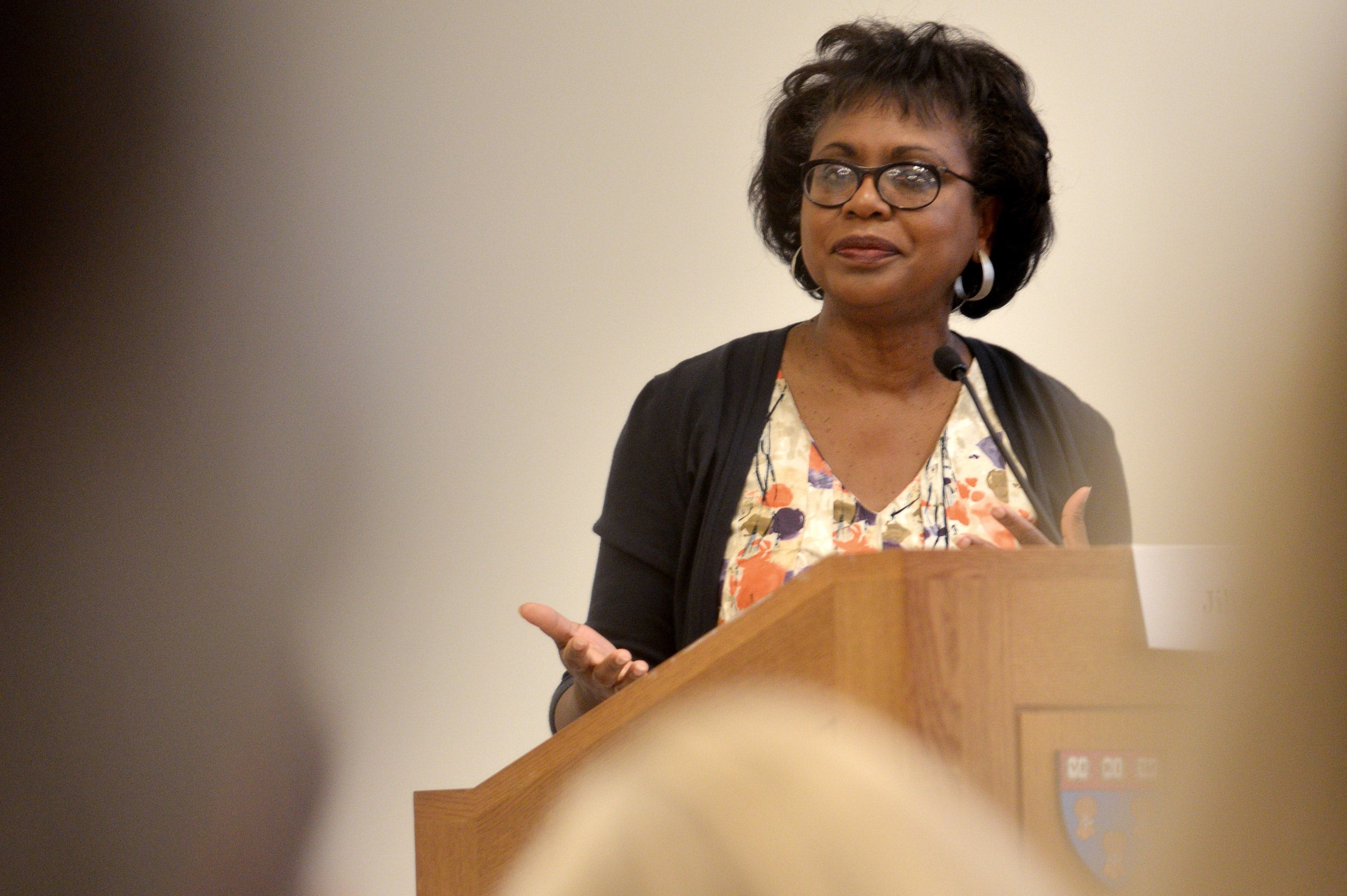 A woman speaking at a podium