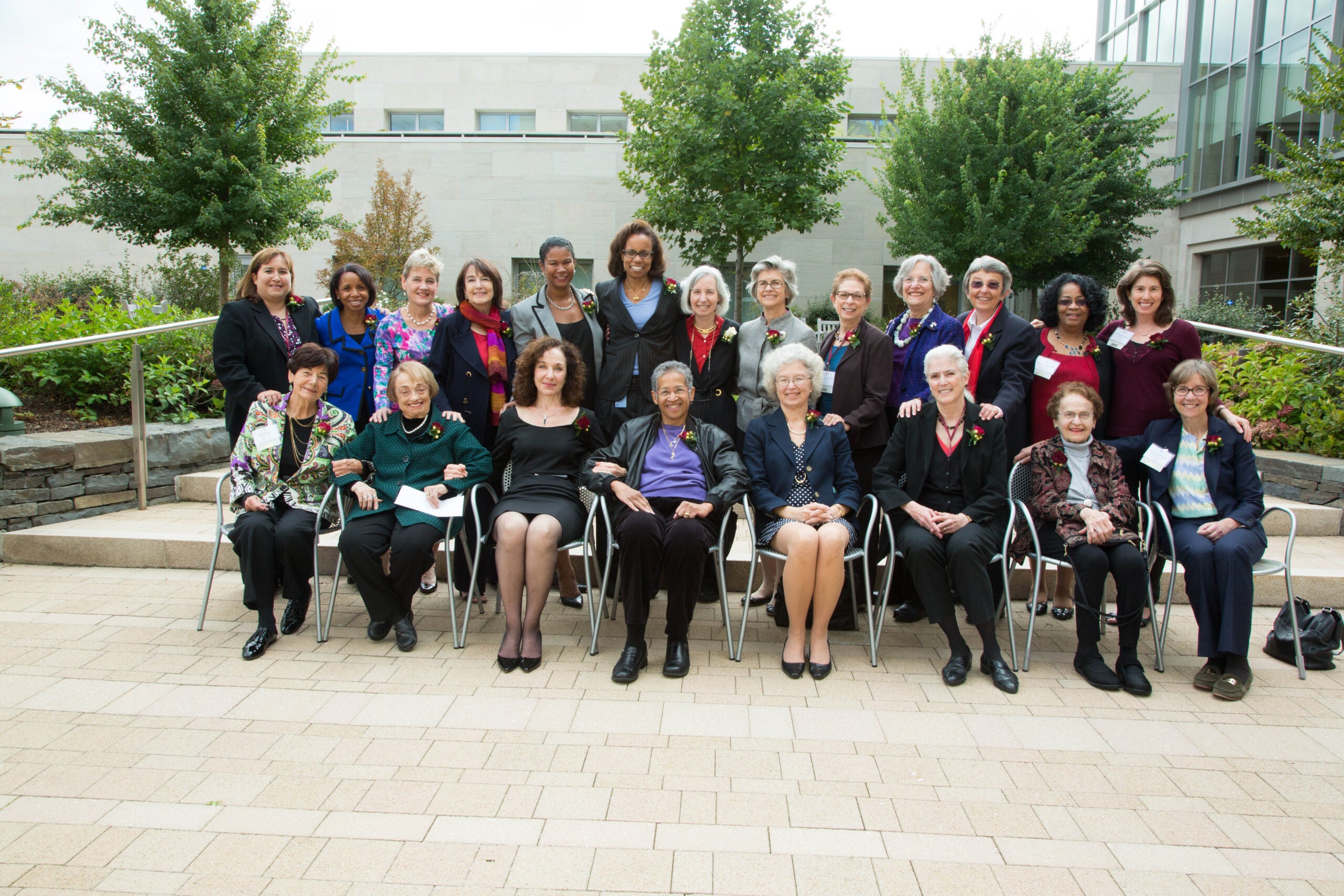 large group of women sitting and standing