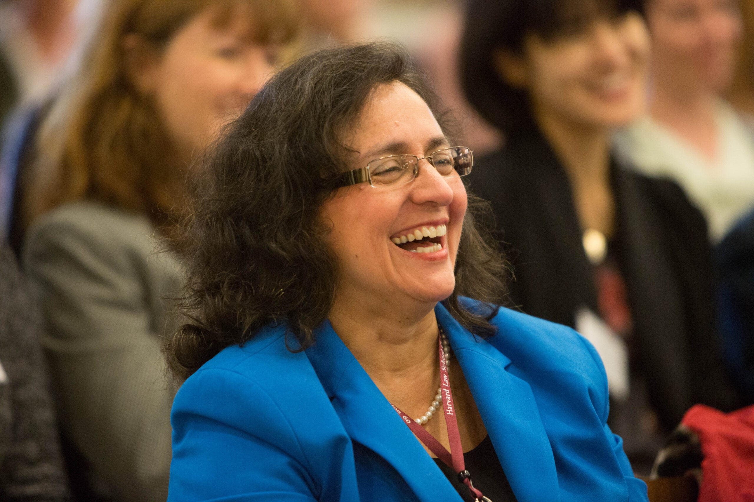 person laughing in a crowd