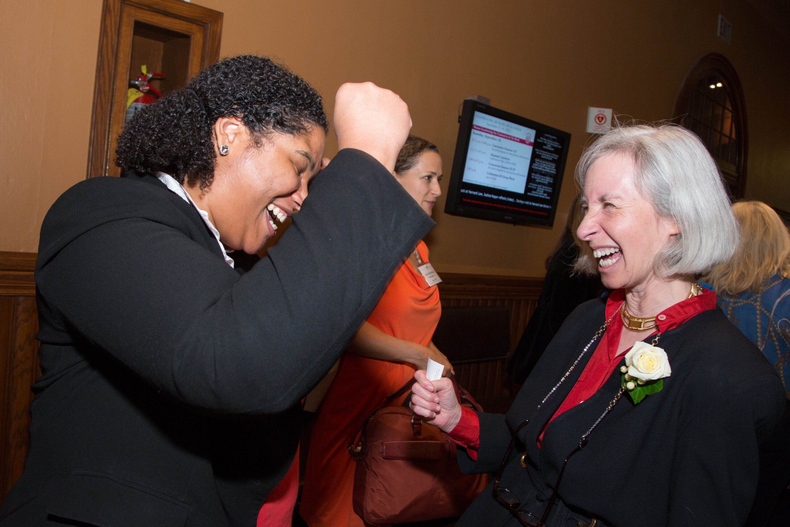 women talking and laughing together