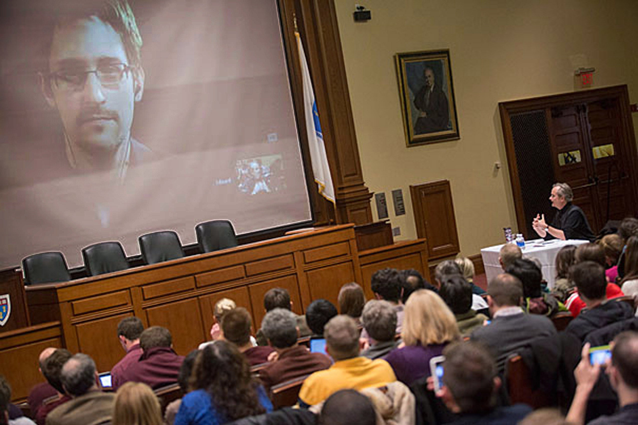 An audience watching a lecture being conducted