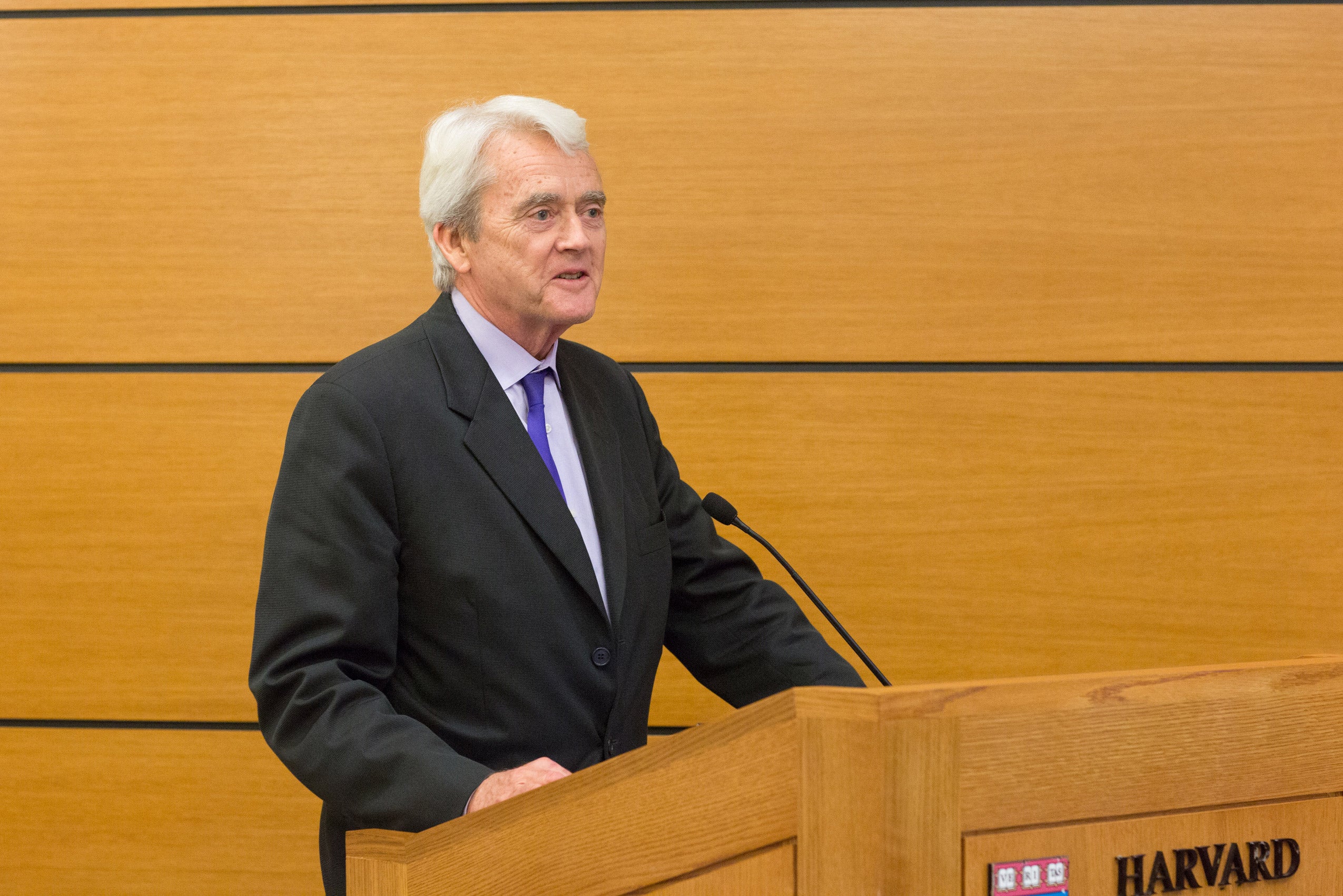 A man speaking at a podium