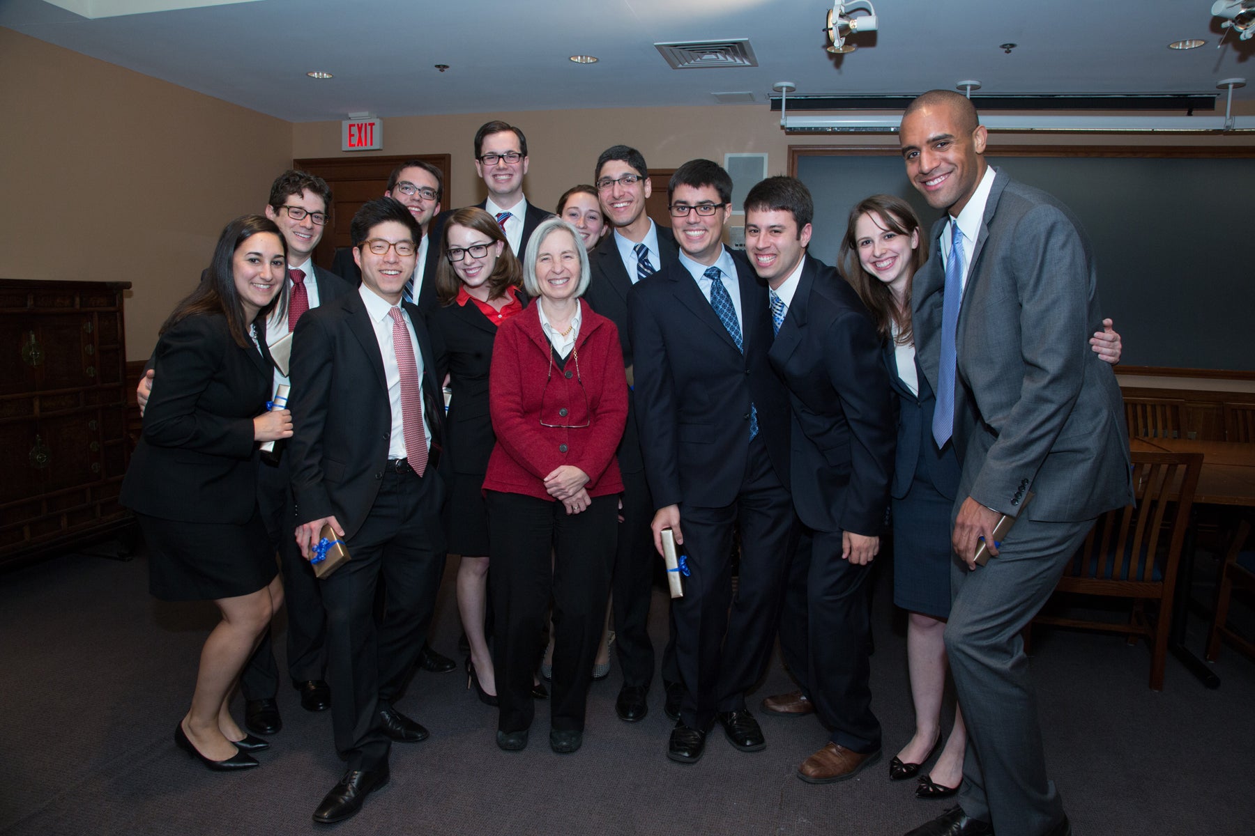 group of people surrounding Dean Martha Minow