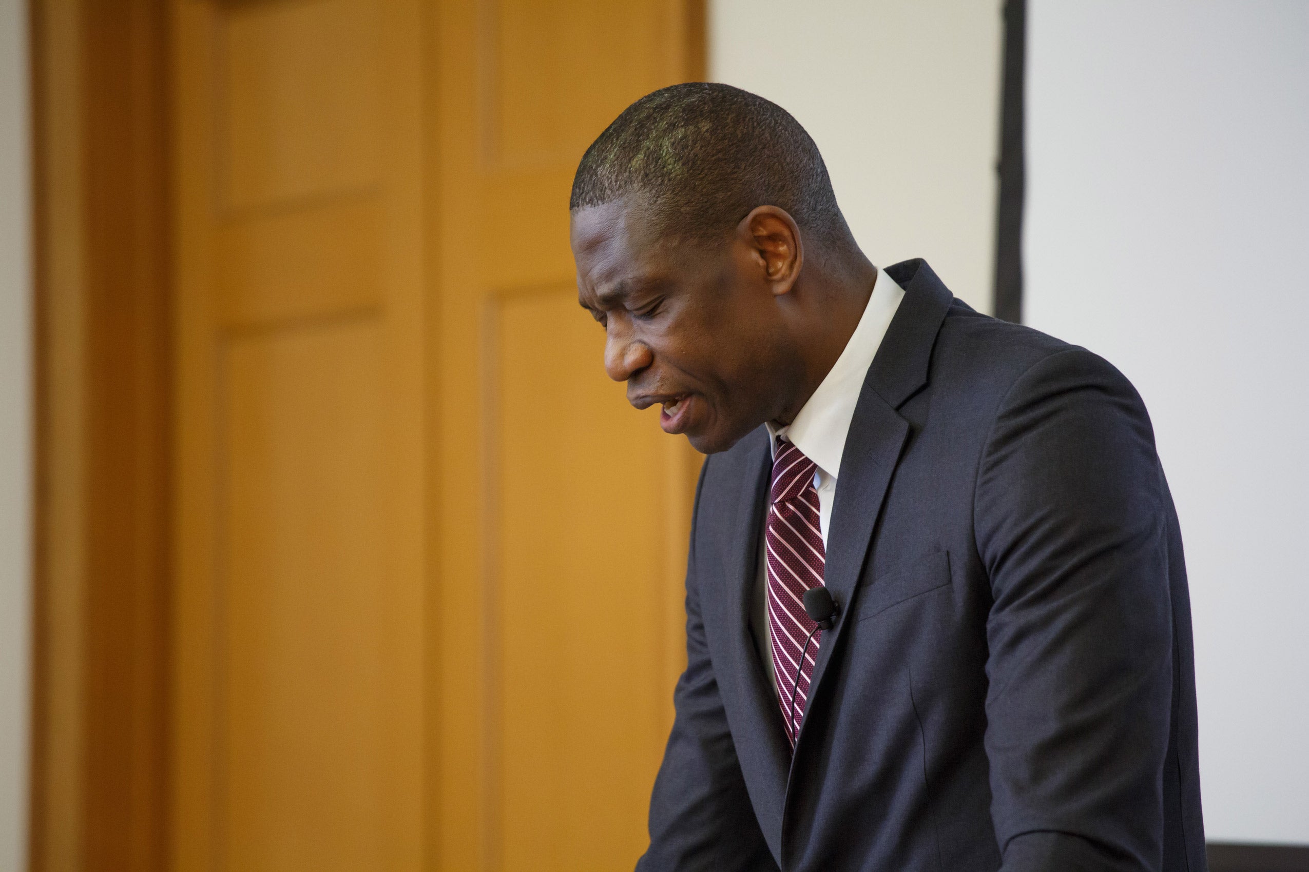 A man standing at a podium, speaking